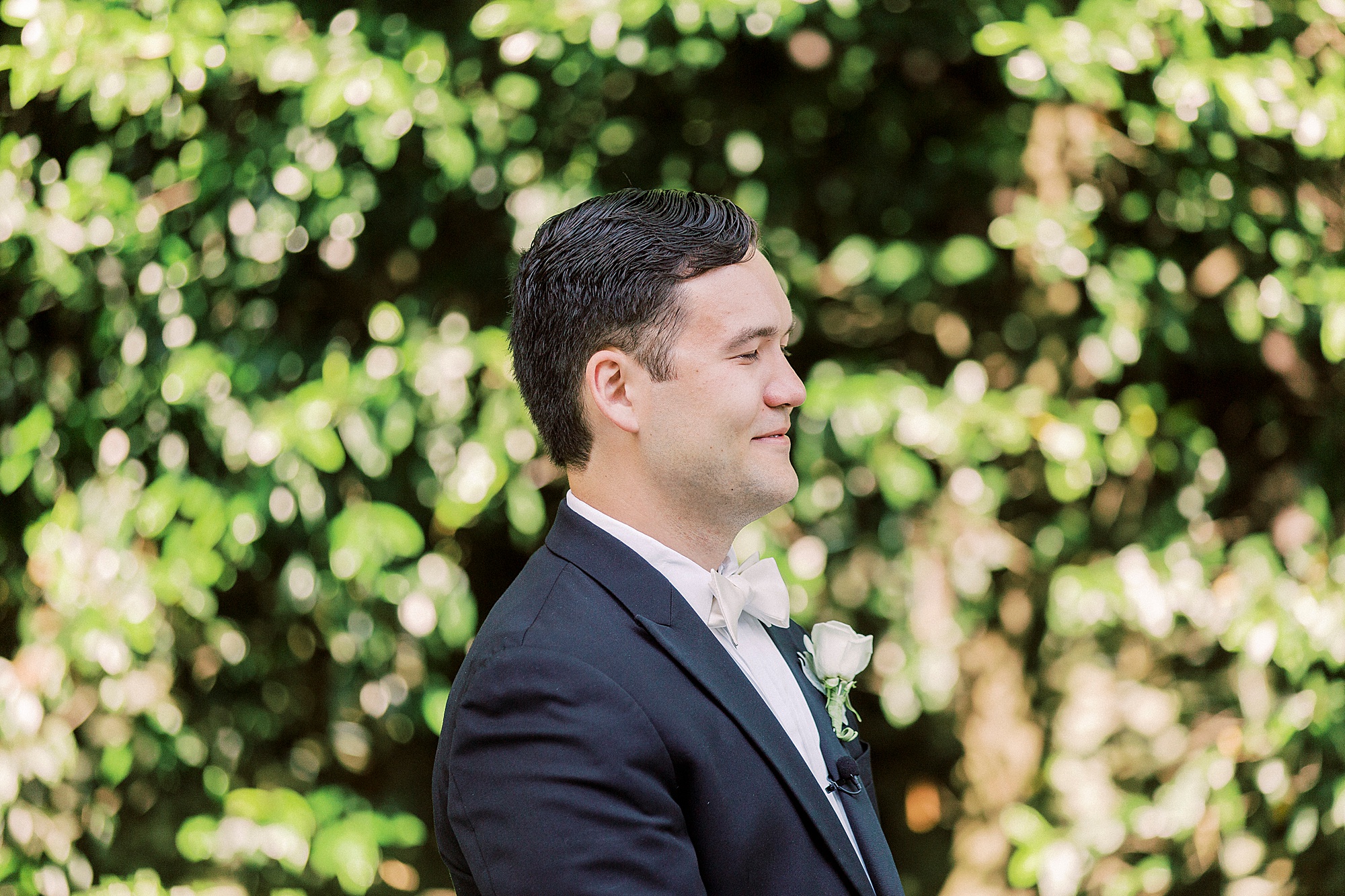 groom cries watching bride walking down aisle during outdoor wedding ceremony at Separk Mansion
