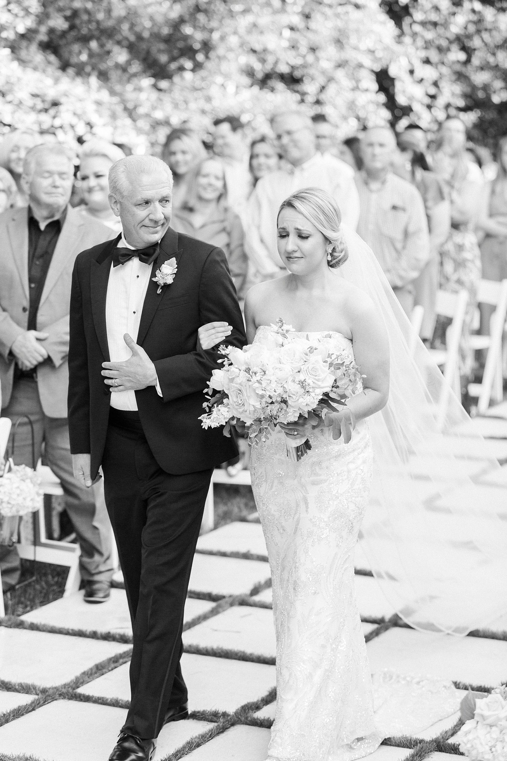 bride walks down aisle with dad during outdoor wedding ceremony at Separk Mansion