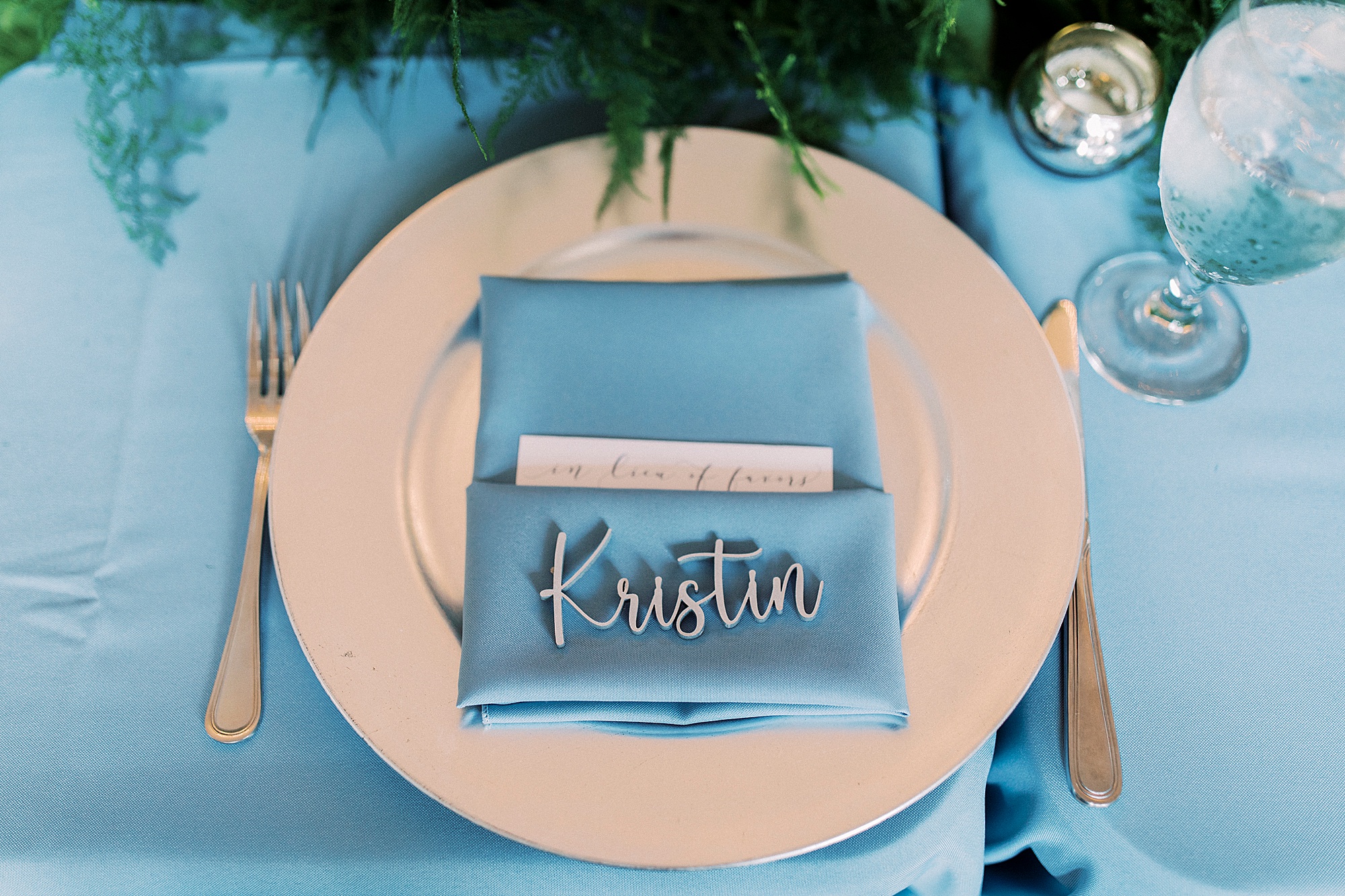 place setting with light blue napkins