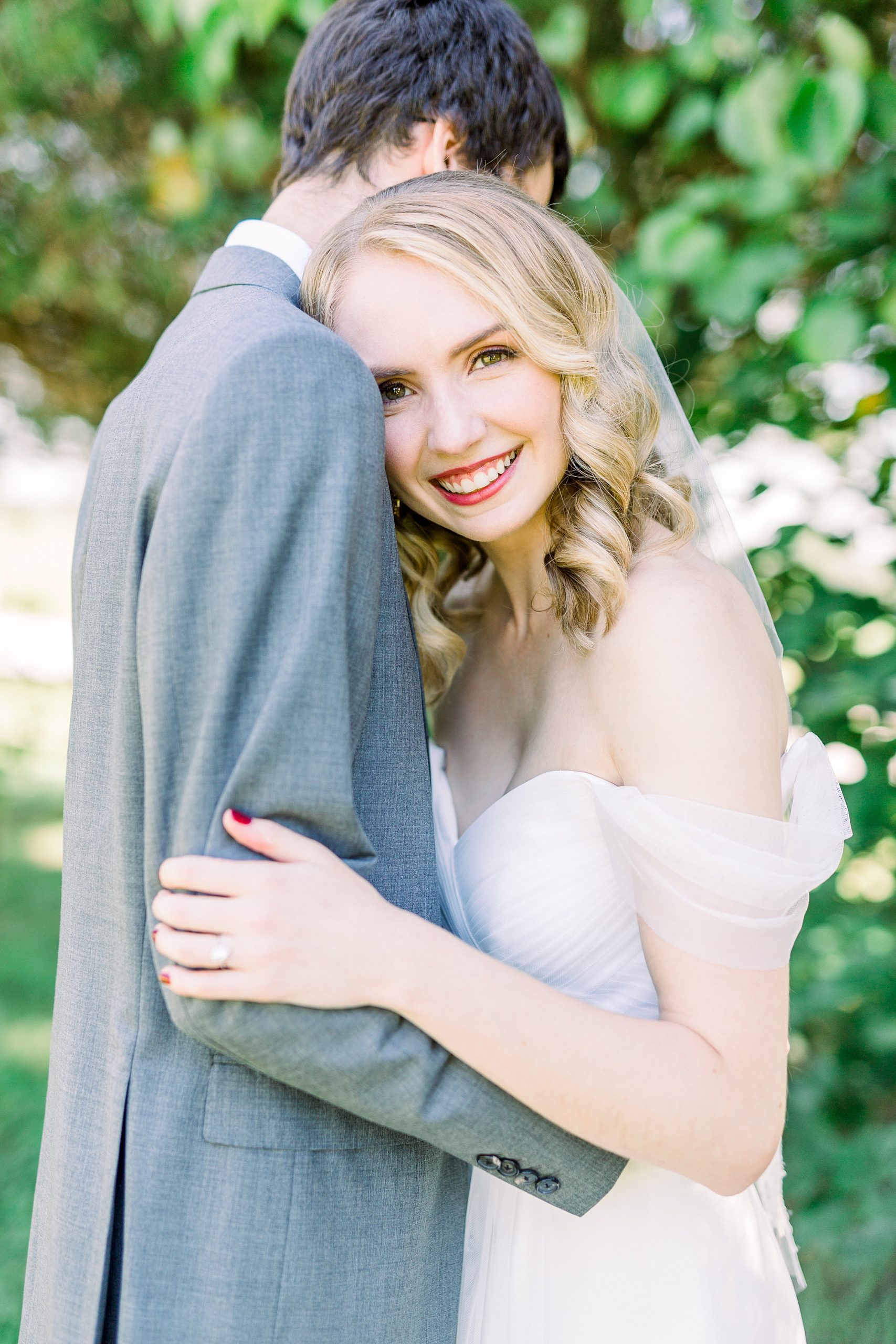 bride leans against groom during portraits in Harmony NC