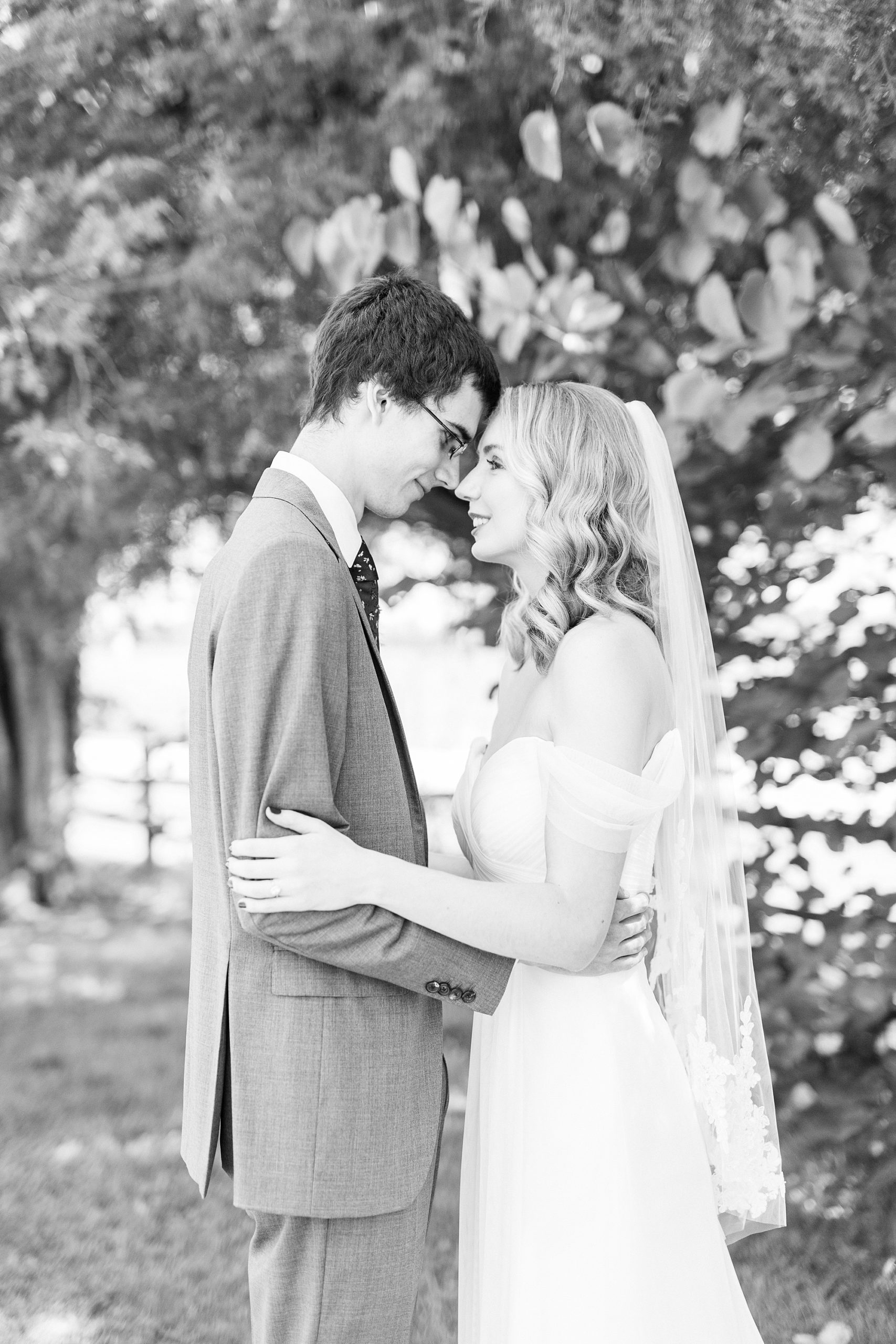 bride and groom stand touching noses in Harmony NC