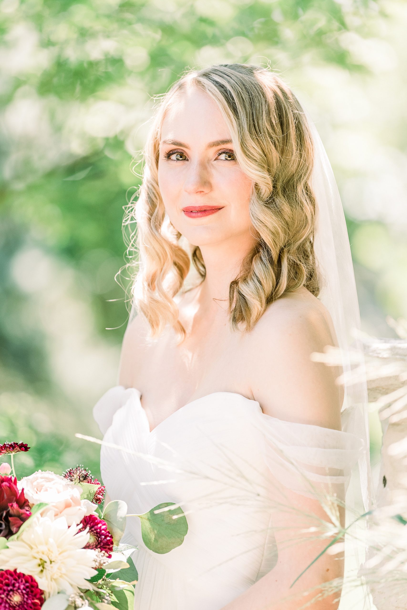bride smiles during portraits at 1812 Hitching Post