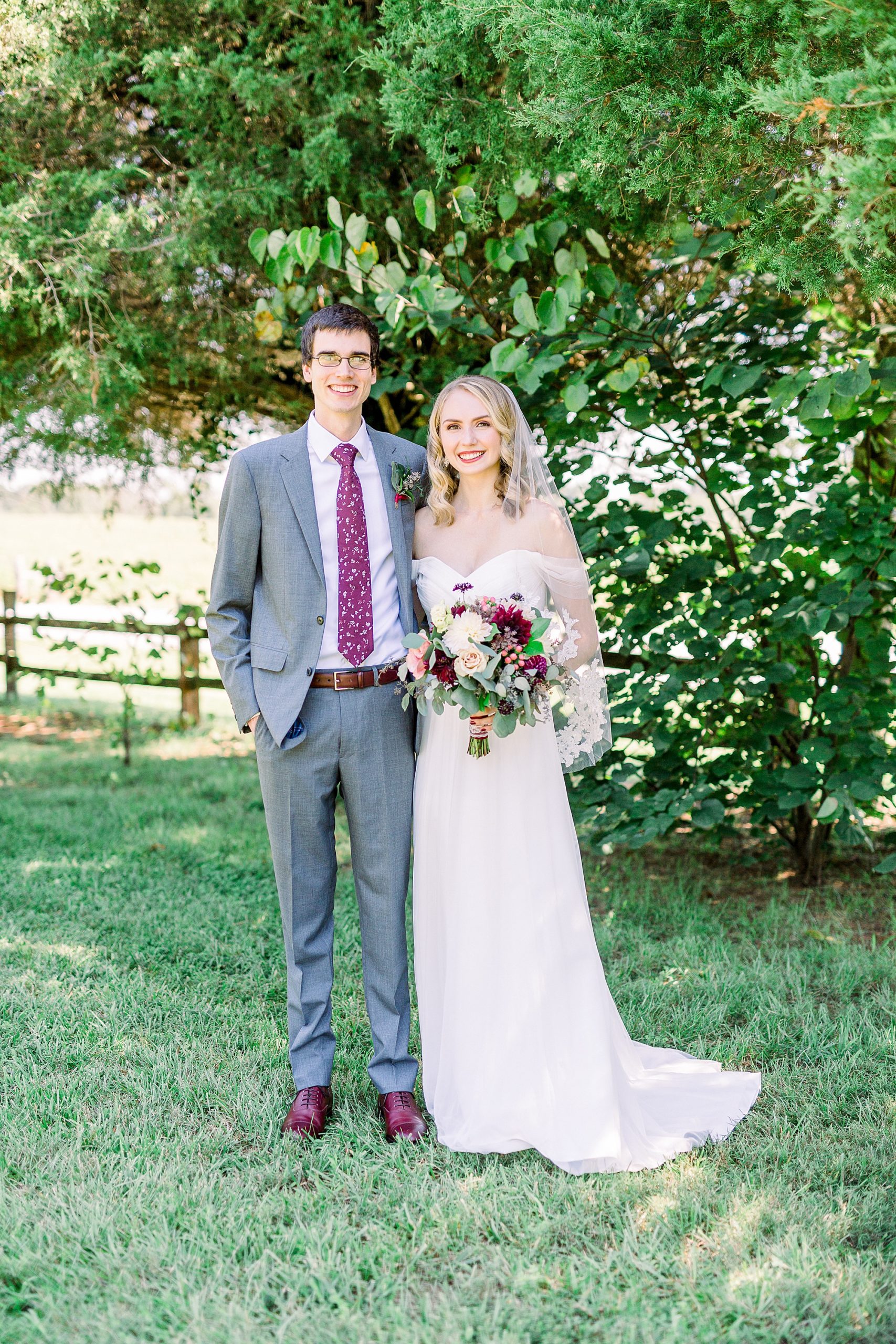 bride and groom stand together at 1812 Hitching Post