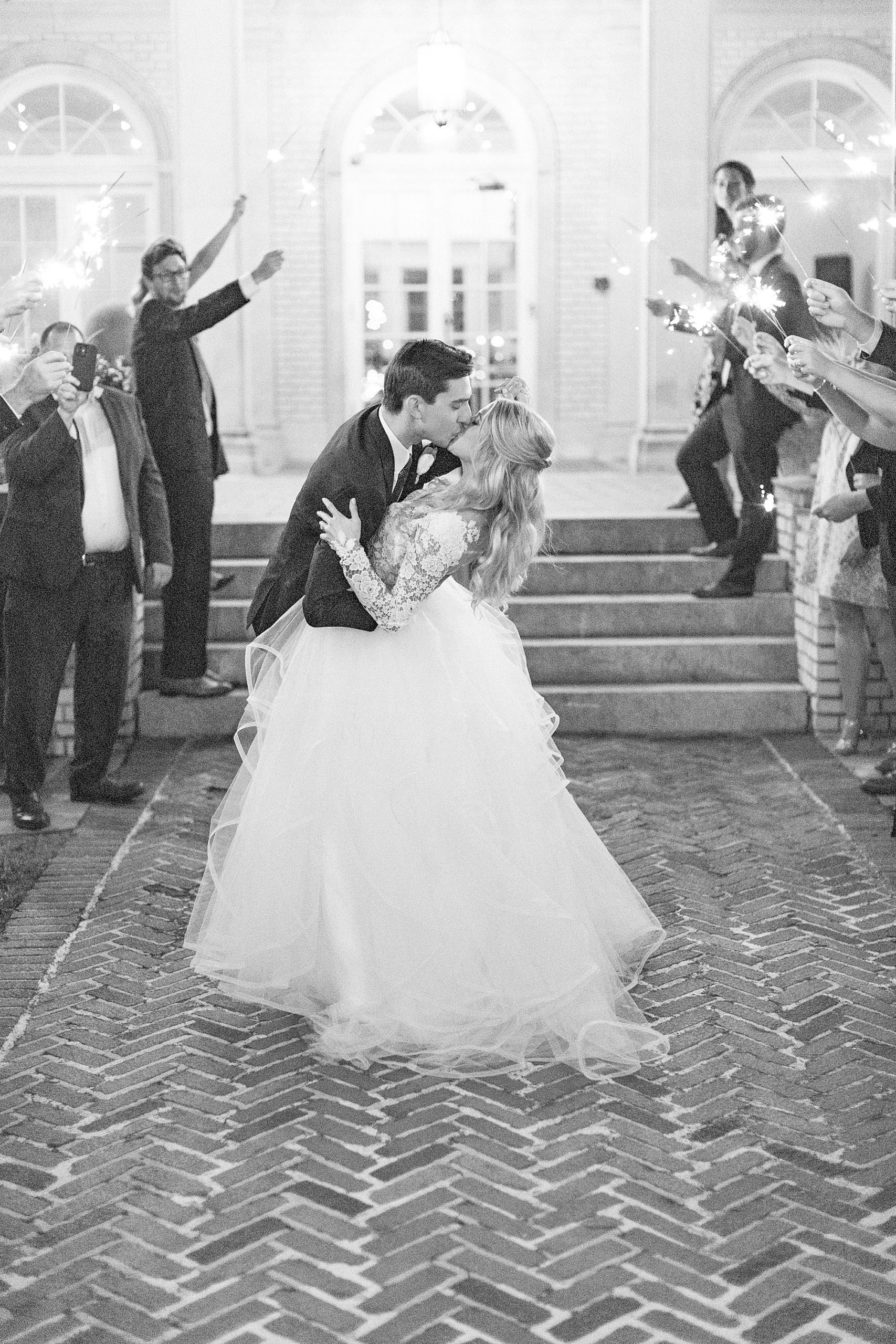 groom and bride kiss during wedding exit at Separk Mansion