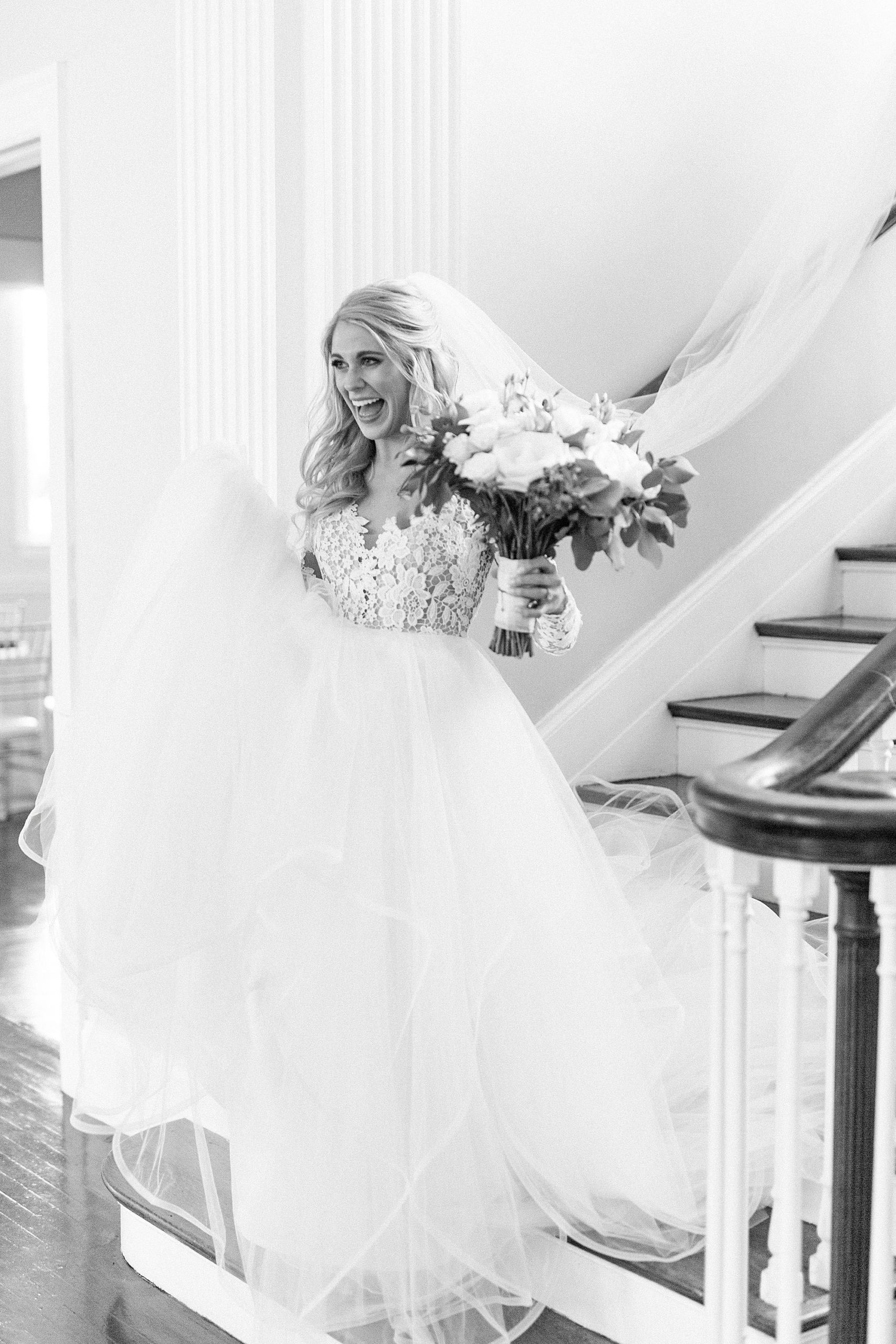 bride walks down steps in hayden olivia bridal gown with veil on at Separk Mansion