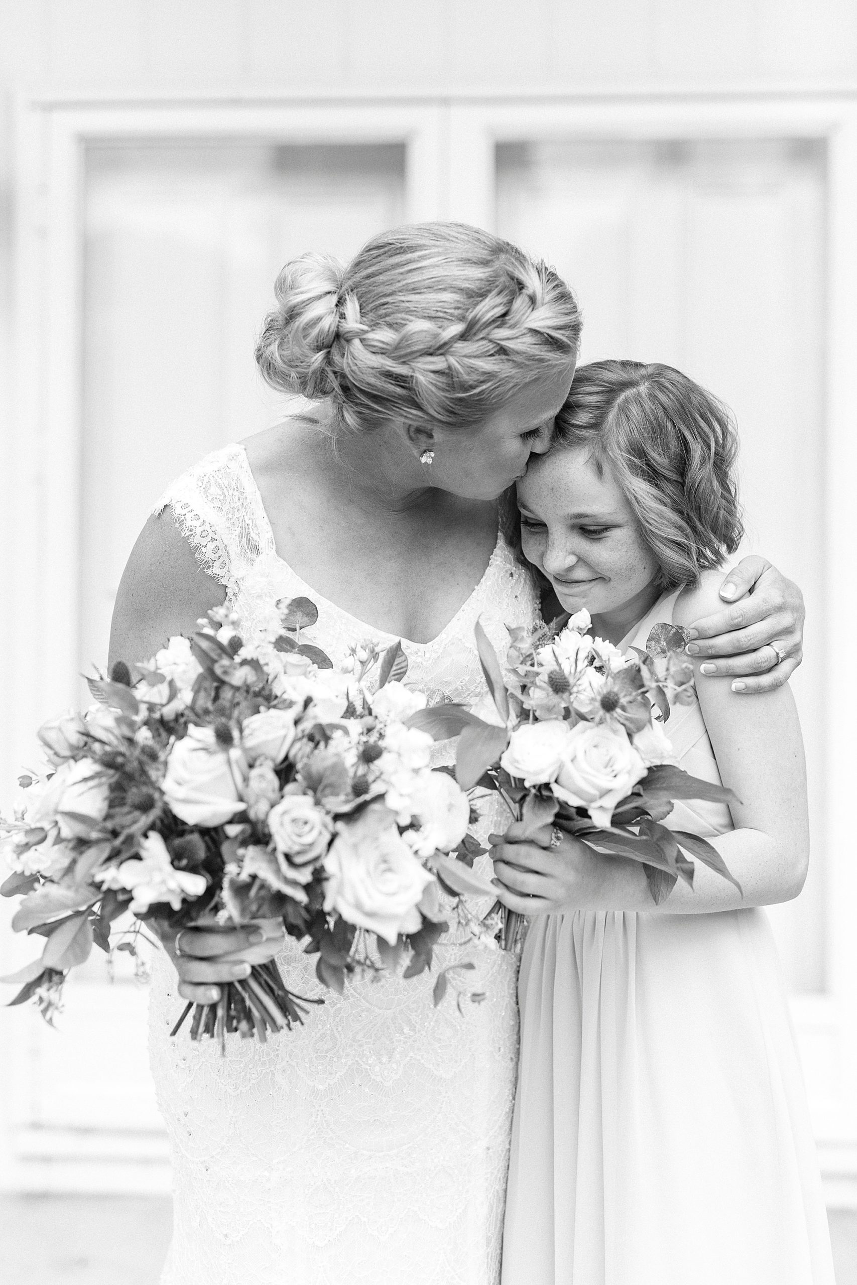 bride kisses daughter during portraits at Separk Mansion