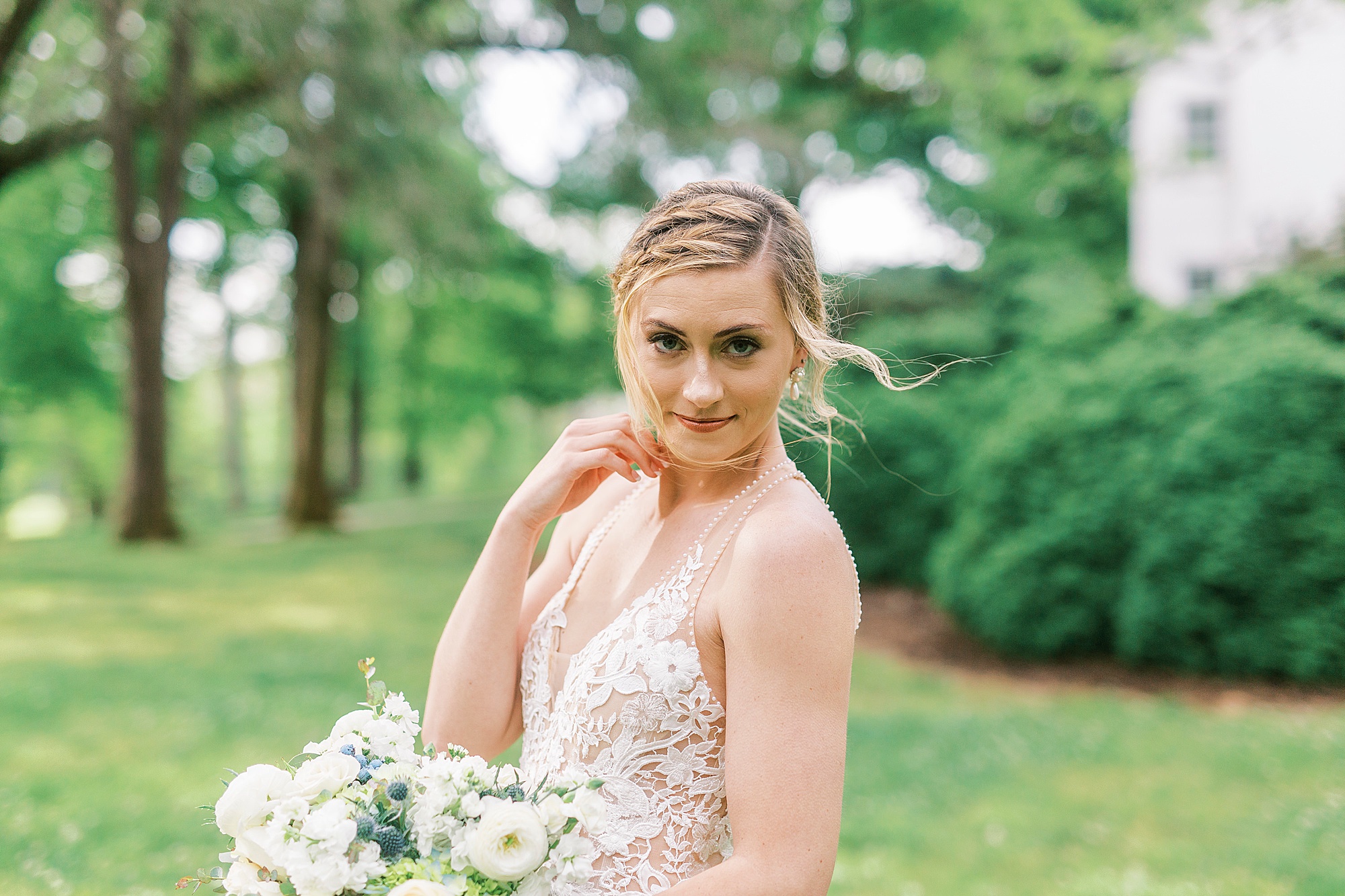 bride holds bouquet during Tanglewood bridal portraits