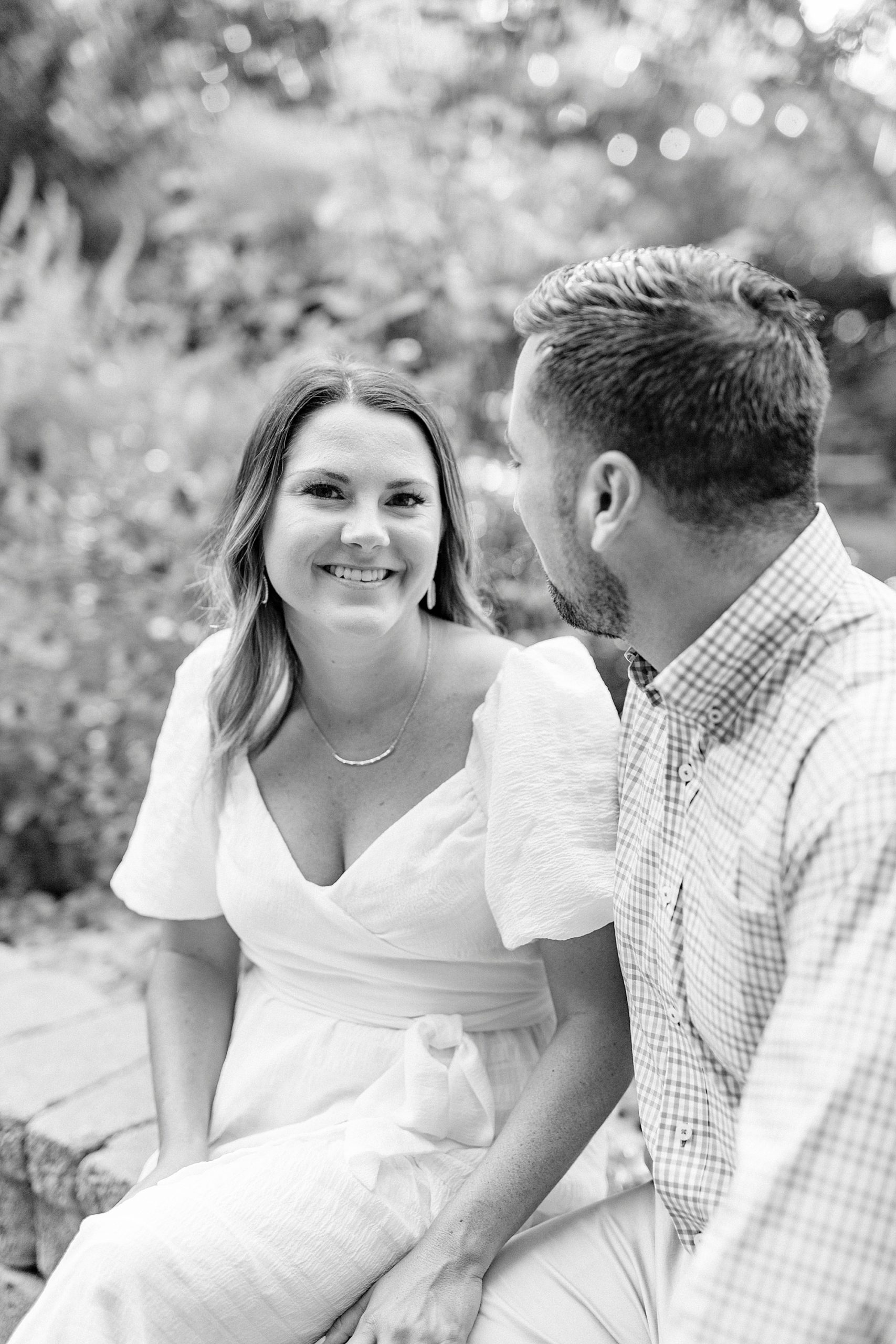 bride laughs while groom looks at her