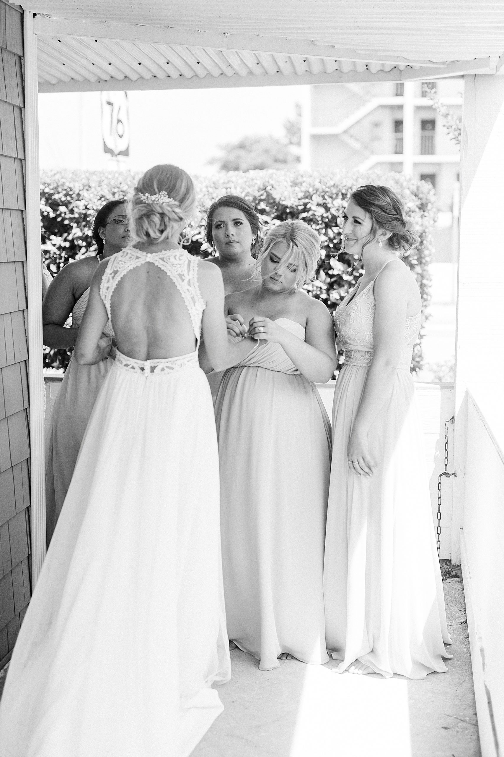 bridesmaids have first look with bride before Oceanic Restaurant wedding