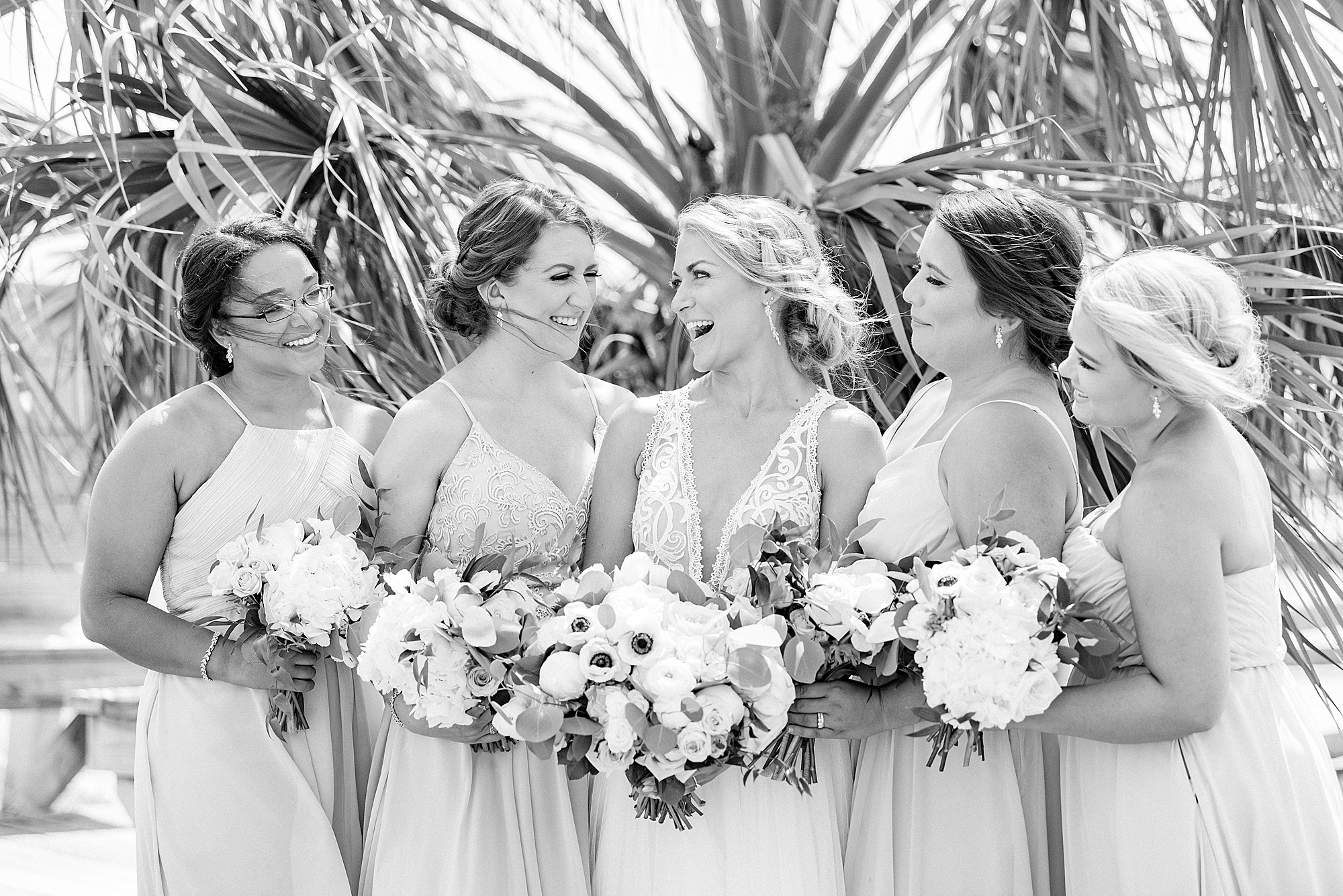bride laughs with bridesmaids before Oceanic Restaurant wedding
