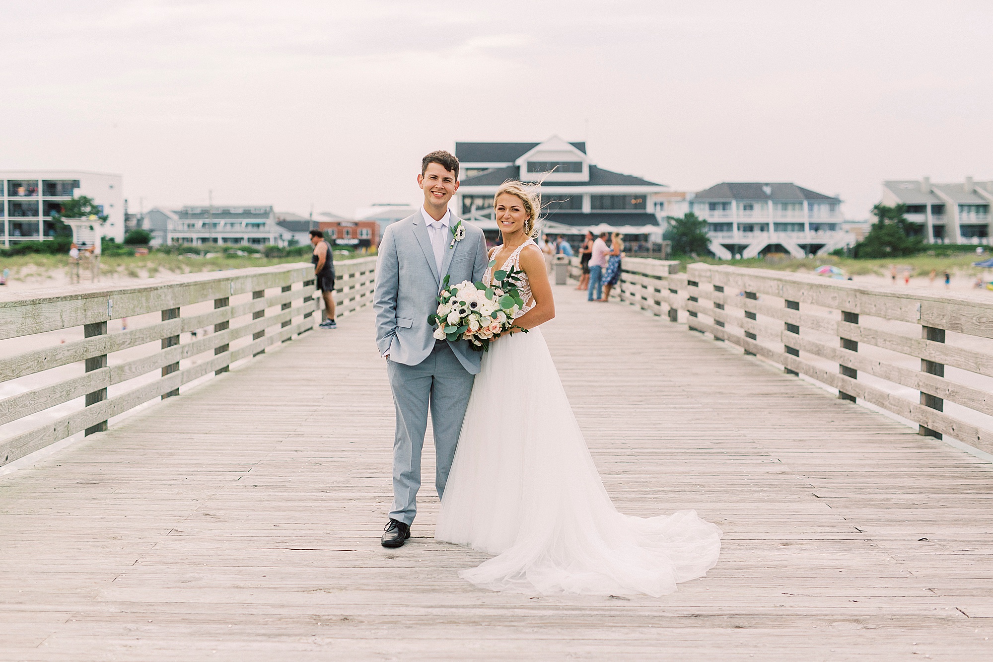 Wrightsville Beach wedding portraits of bride and groom on dock