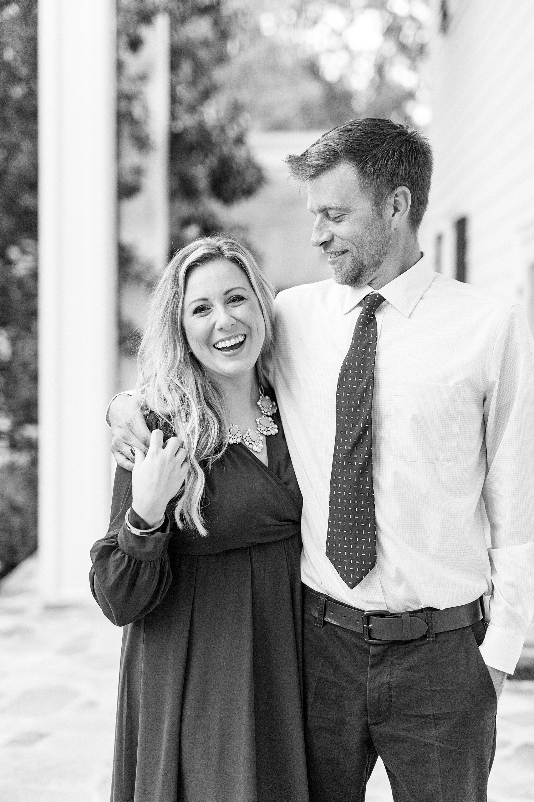 engaged couple laughs together during NC engagement session