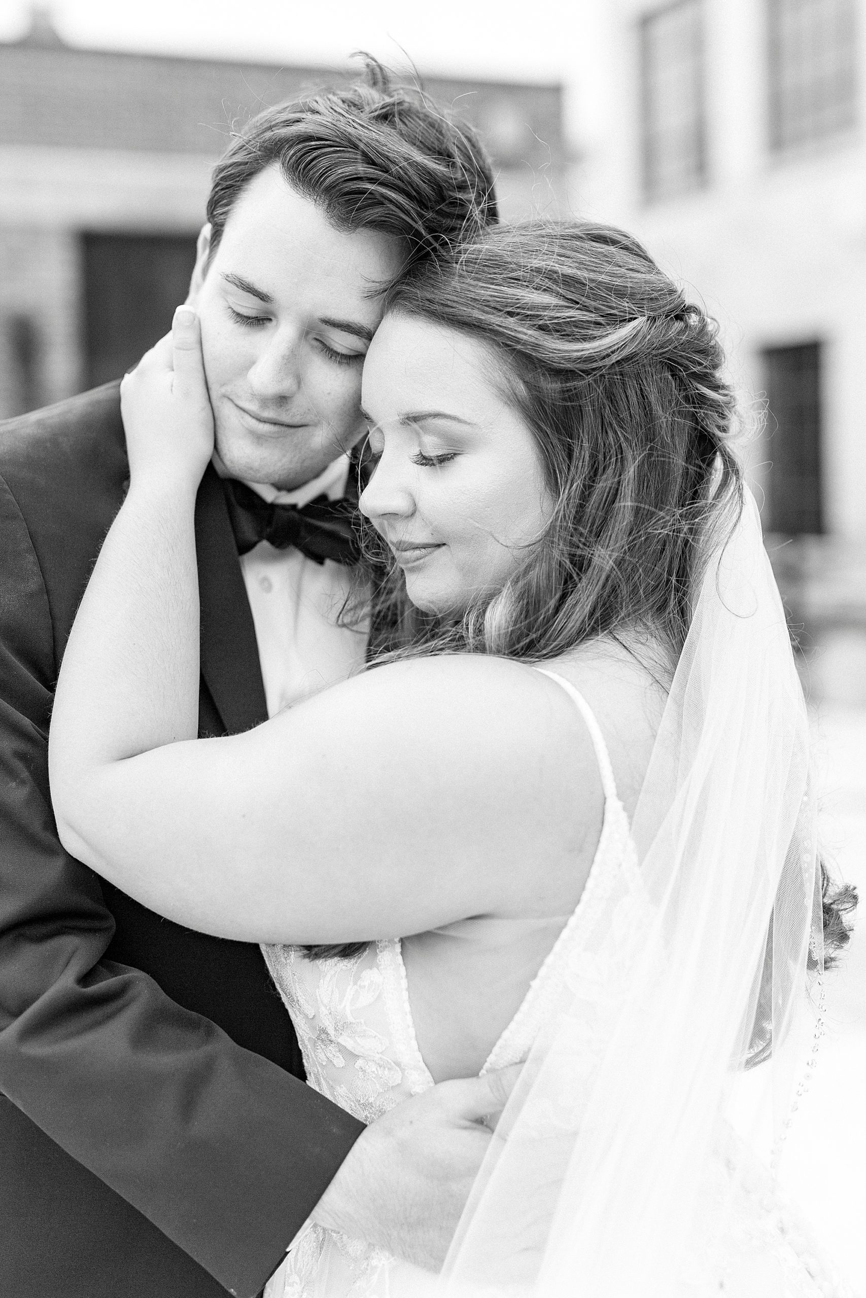 bride and groom hug during NC wedding portraits