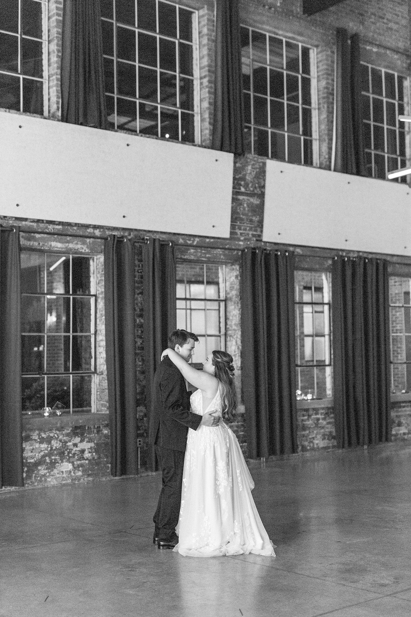 husband and wife have last dance at the Cadillac Service Garage