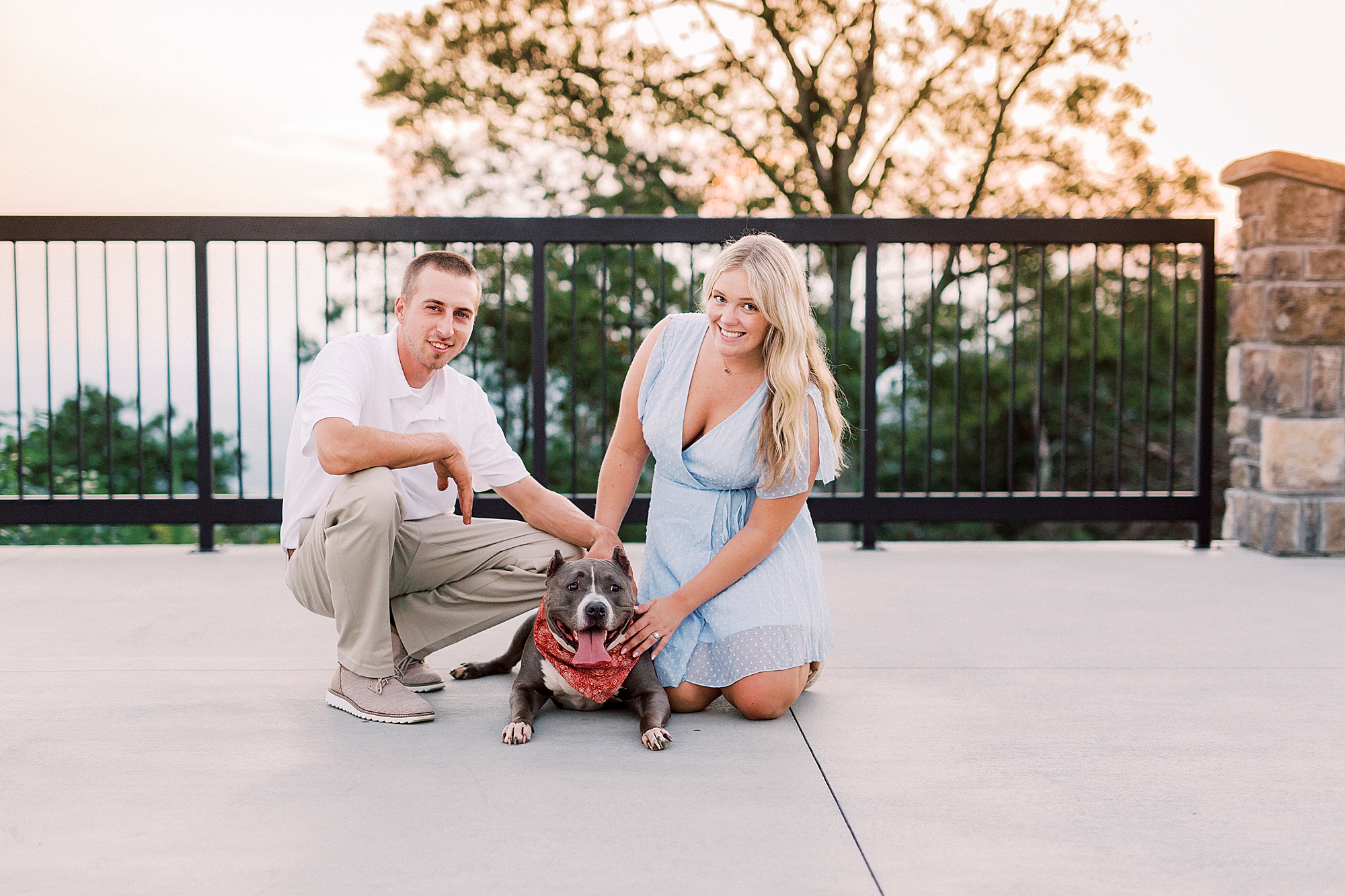 bride and groom pose with dog during Mount Airy engagement session
