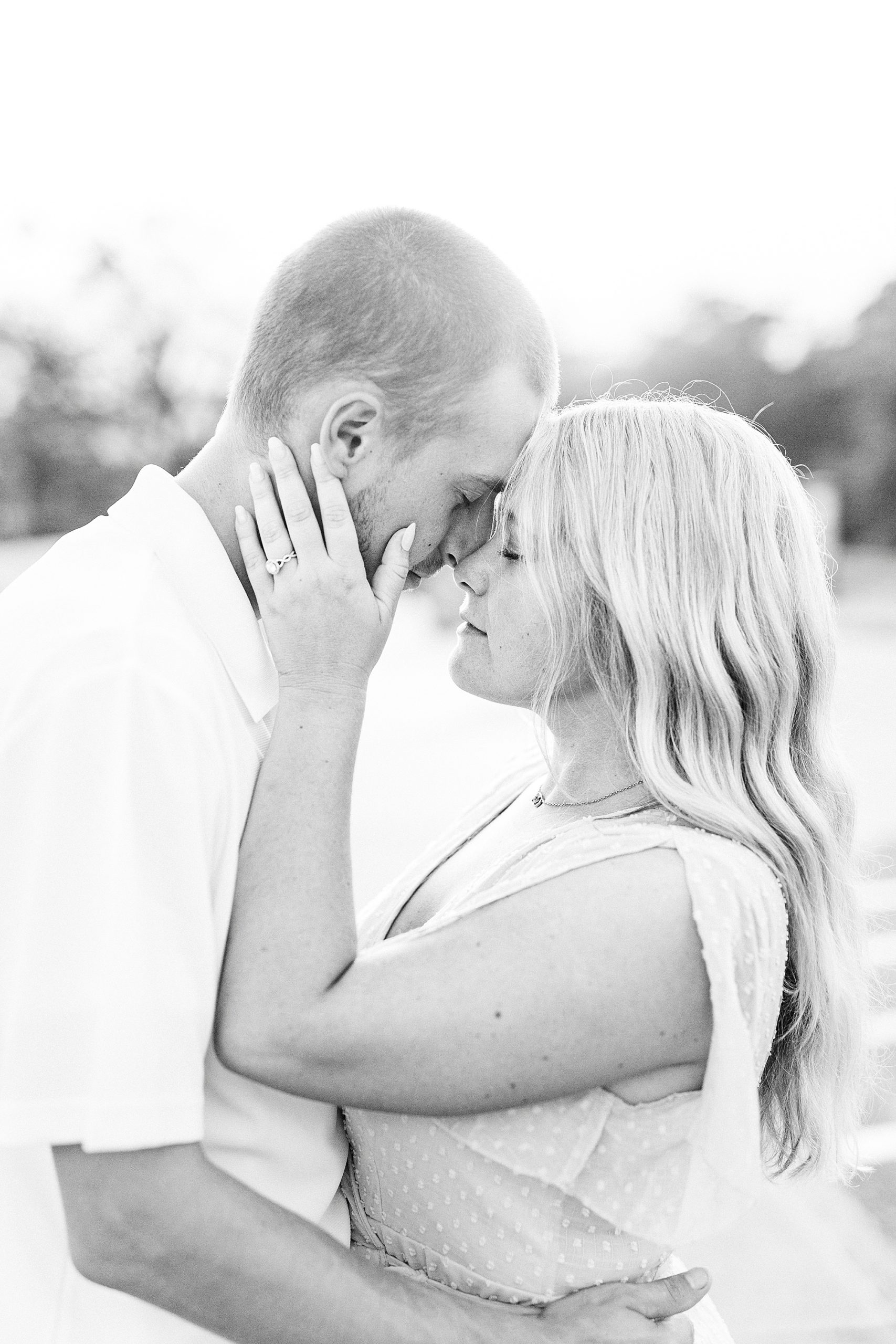 engaged couple stand nose to nose during Mount Airy engagement session