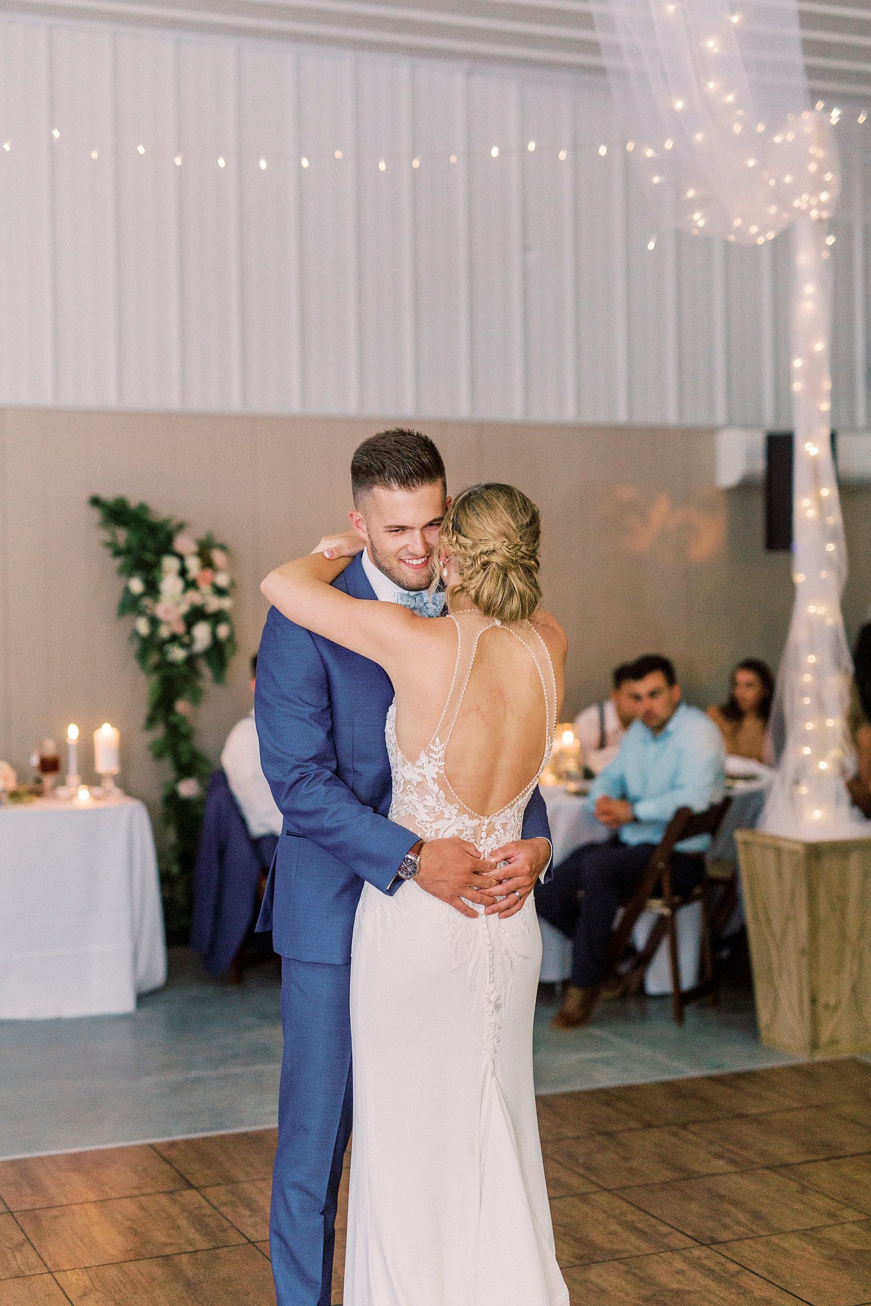 newlyweds have first dance in barn