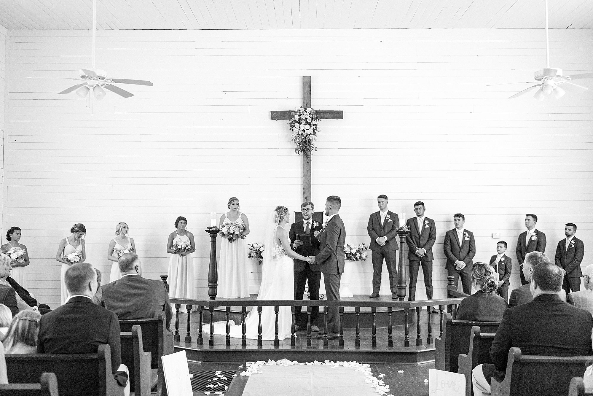 newlyweds stand during traditional church wedding in Winston-Salem NC