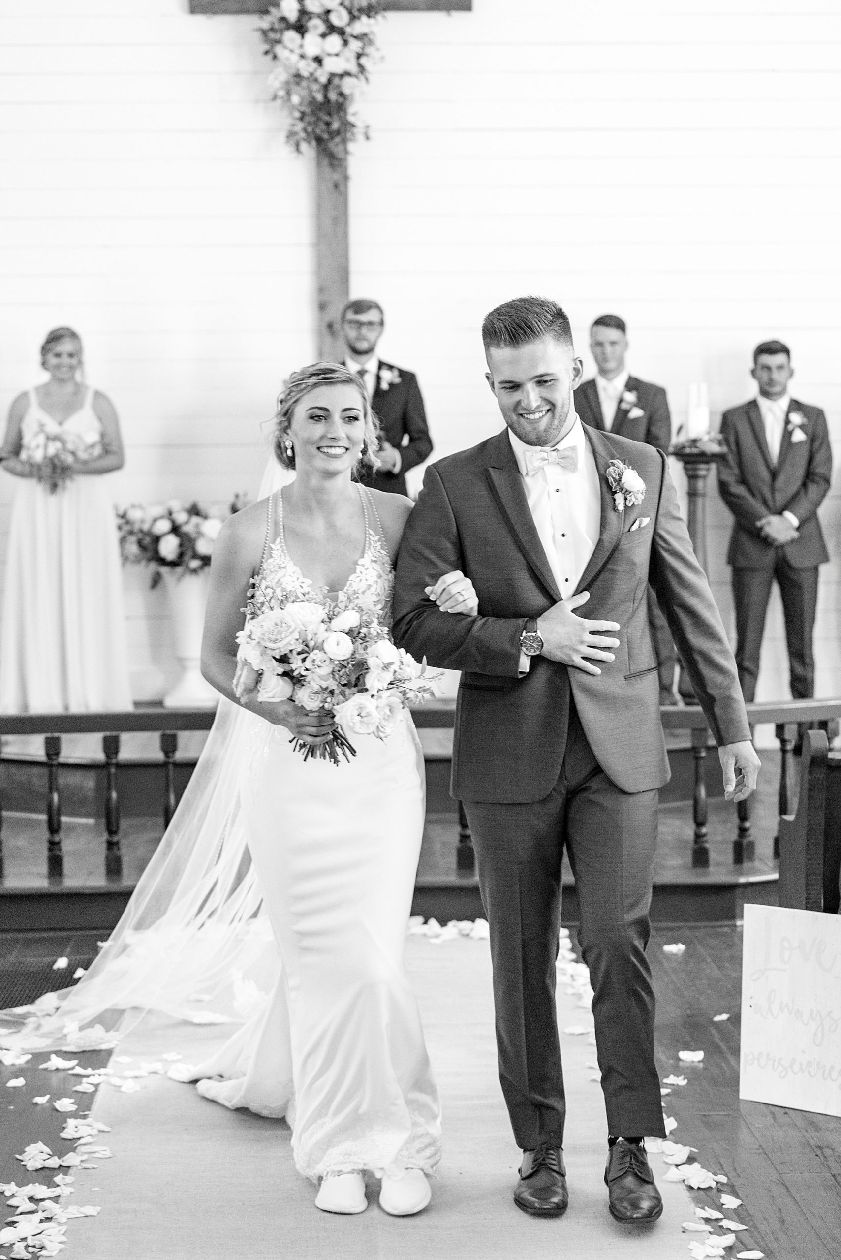 bride and groom walk up aisle after traditional church wedding in Winston-Salem NC