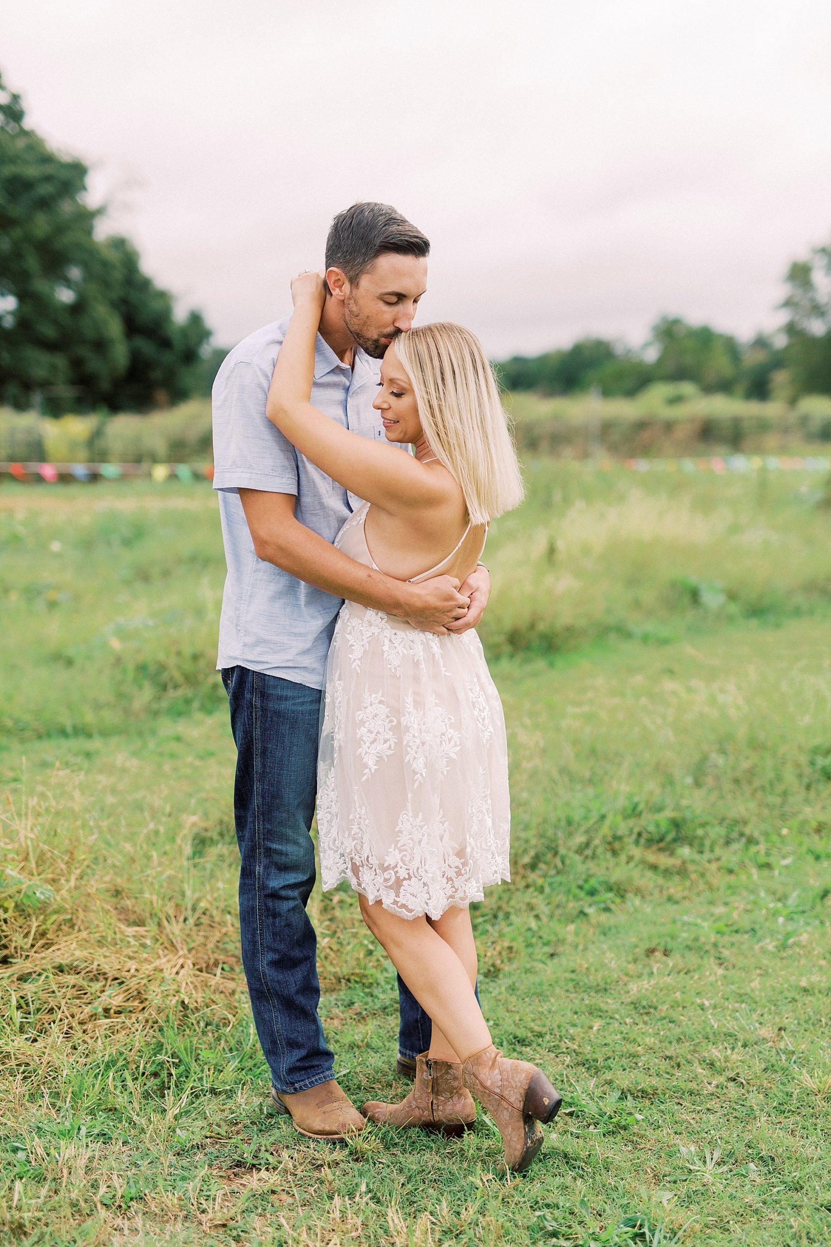 bride and groom hug during engagement photos at Hodges Family Farm