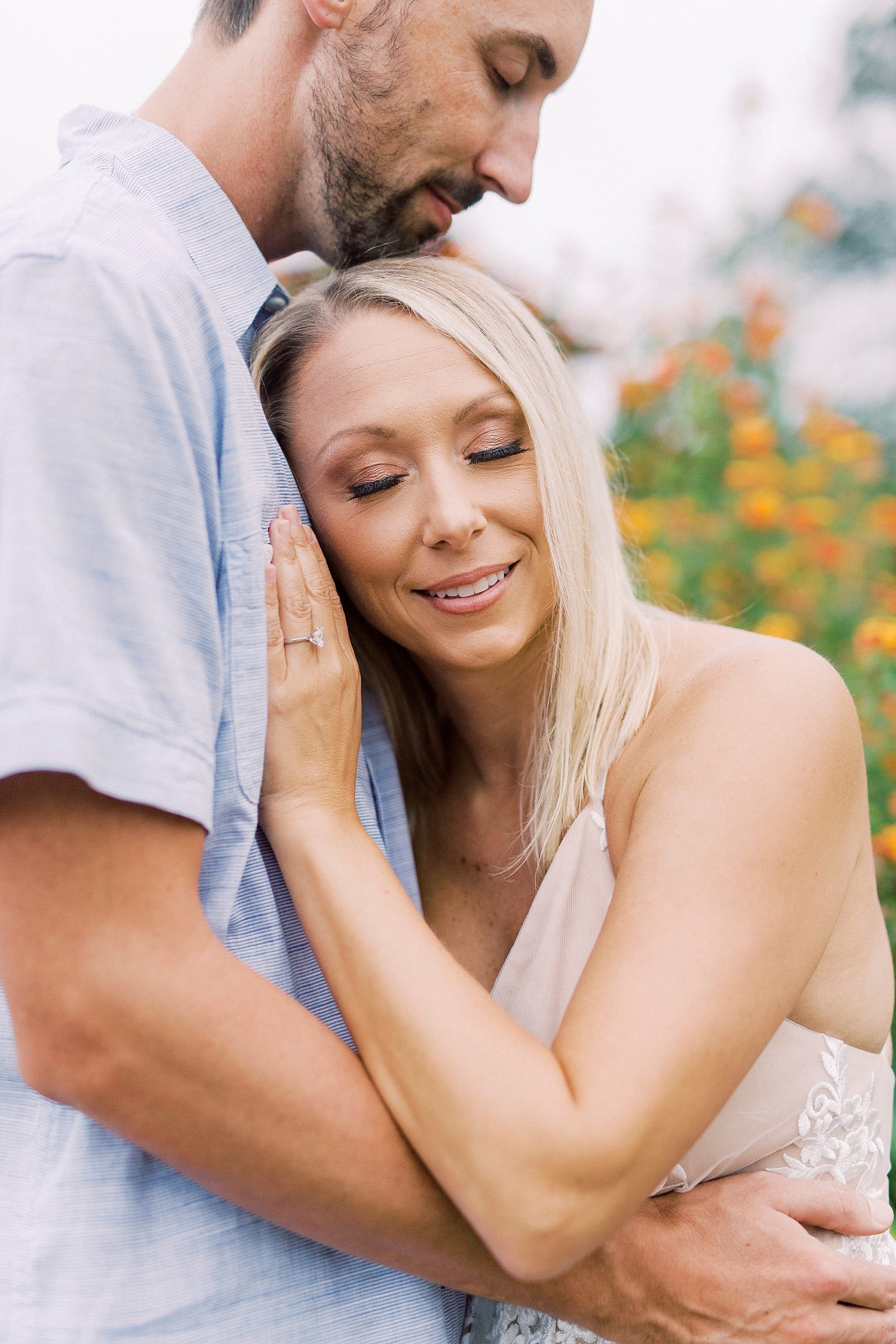 bride leans on groom's chest during Hodges Family Farm engagement session
