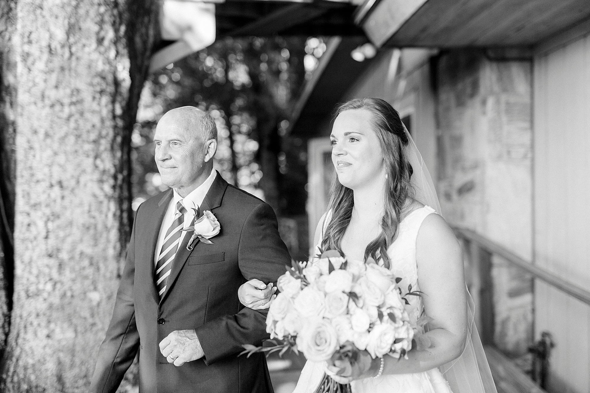 bride and dad walk into wedding ceremony in Blowing Rock NC