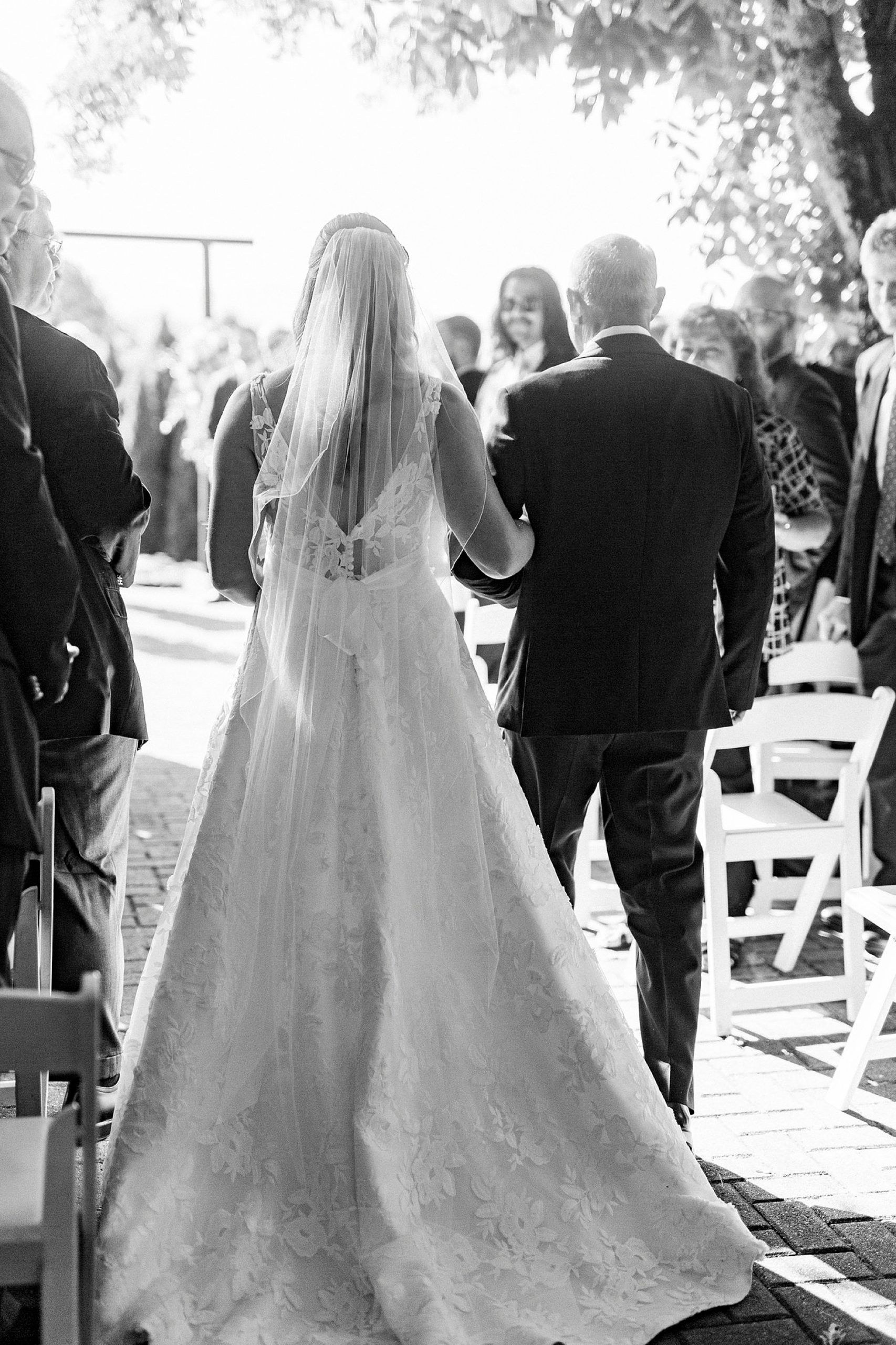 bride walks down aisle with dad for The Inn at Crestwood wedding ceremony