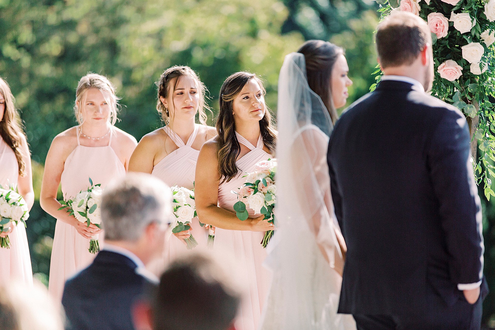 bridesmaids watch couple during The Inn at Crestwood wedding ceremony