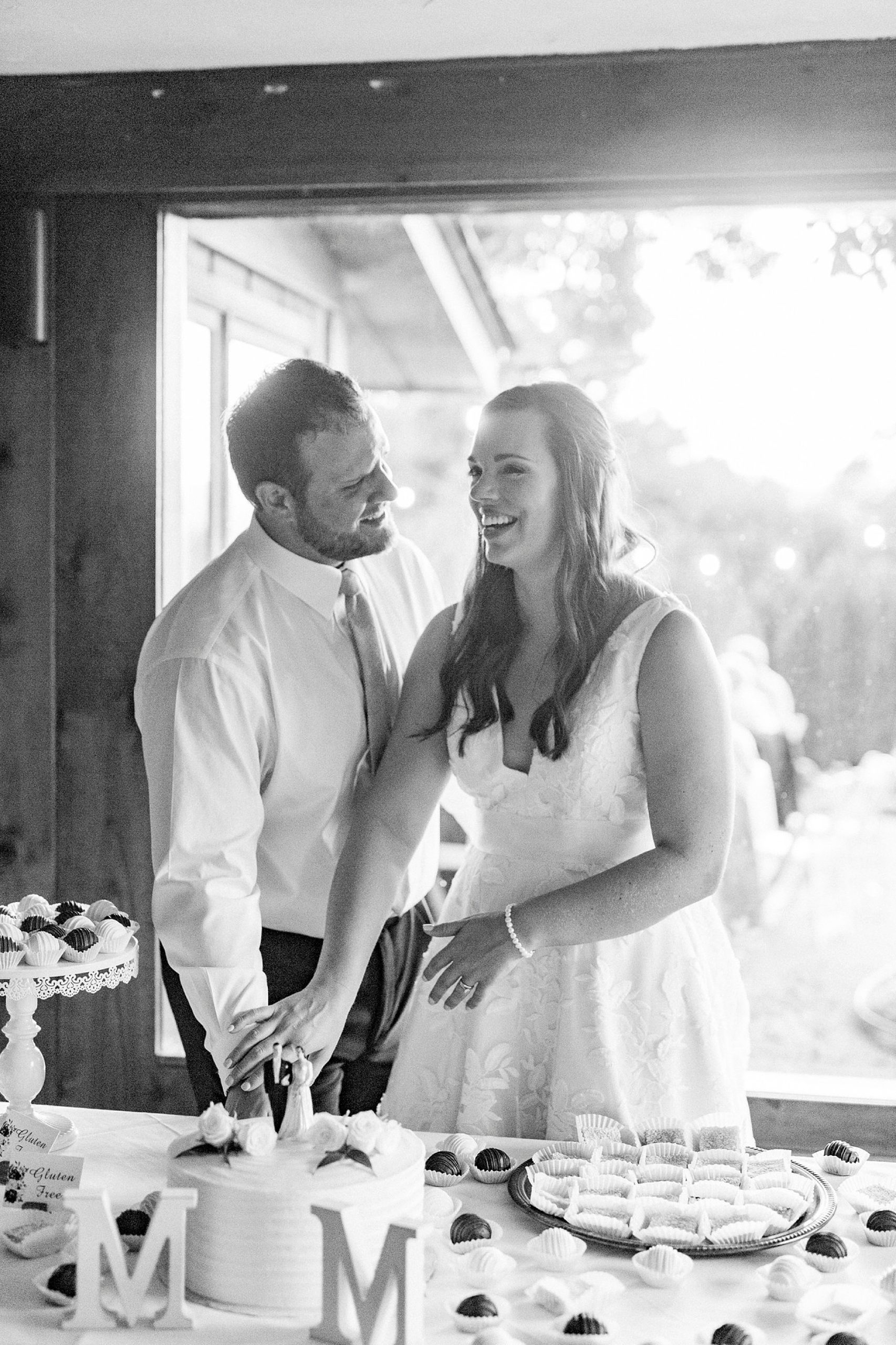 bride and groom laugh together during Blowing Rock NC wedding reception