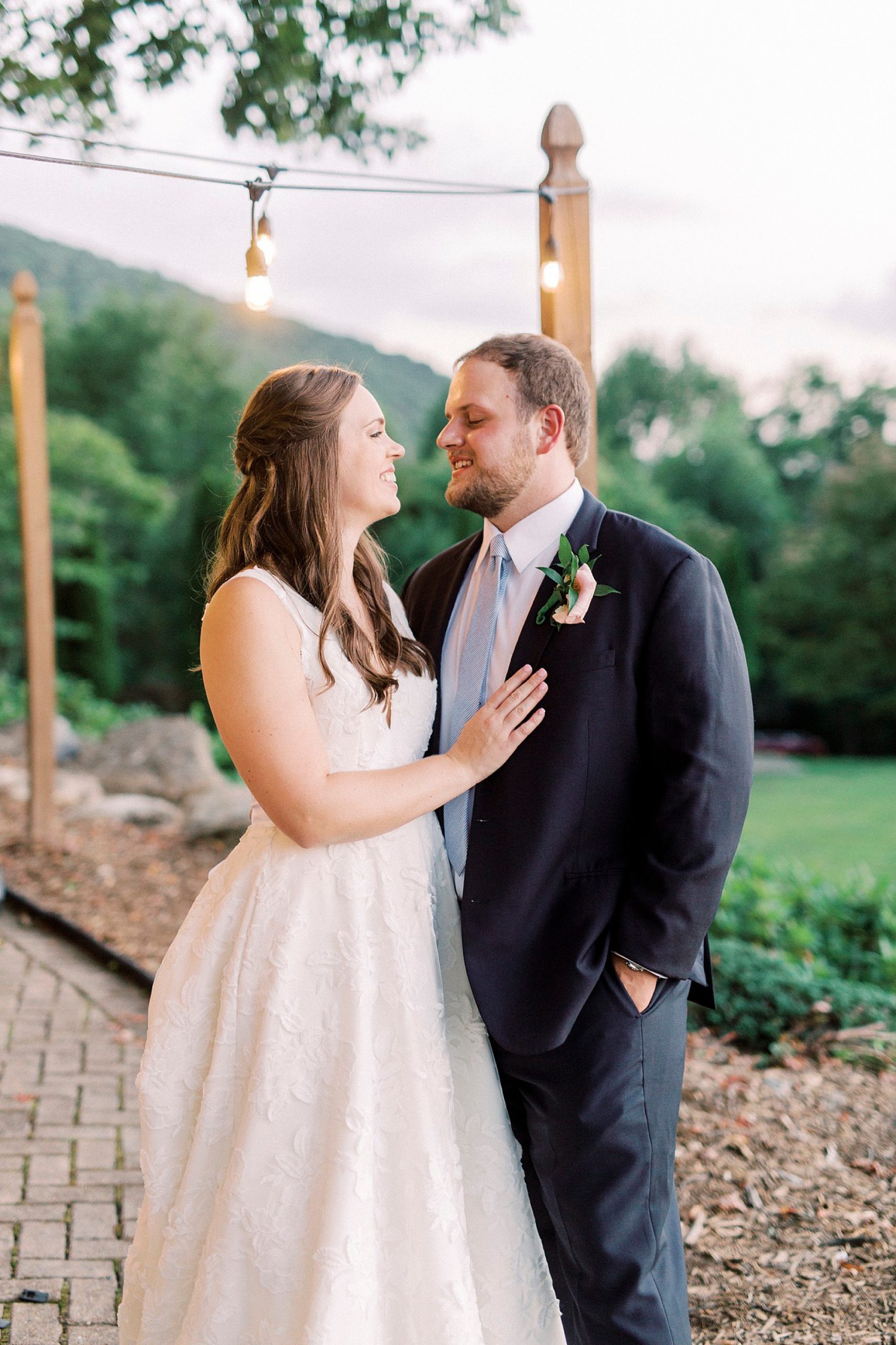 bride and groom smile together during Blowing Rock NC wedding reception