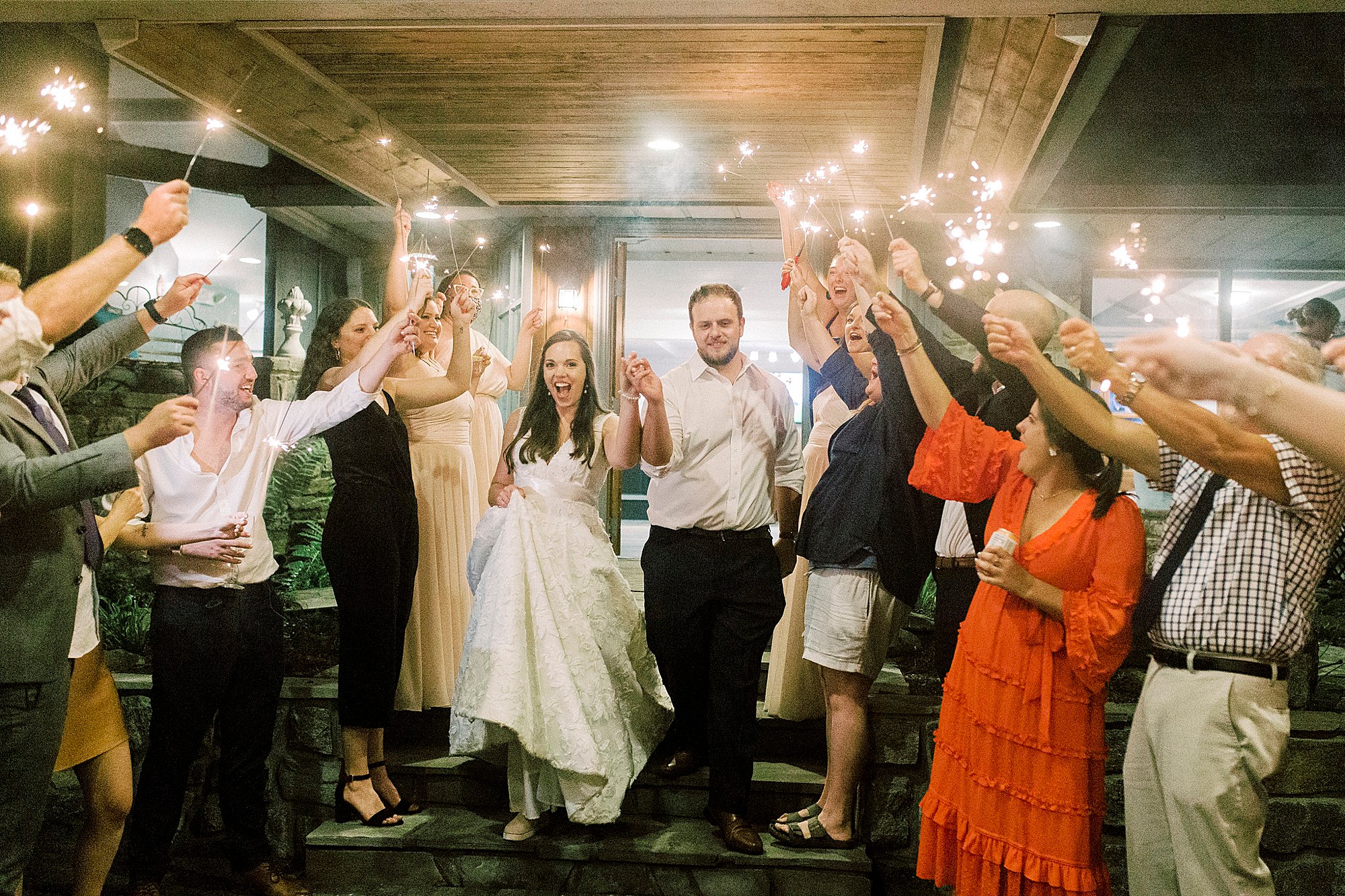 newlyweds leave Blowing Rock NC wedding reception during sparkler exit