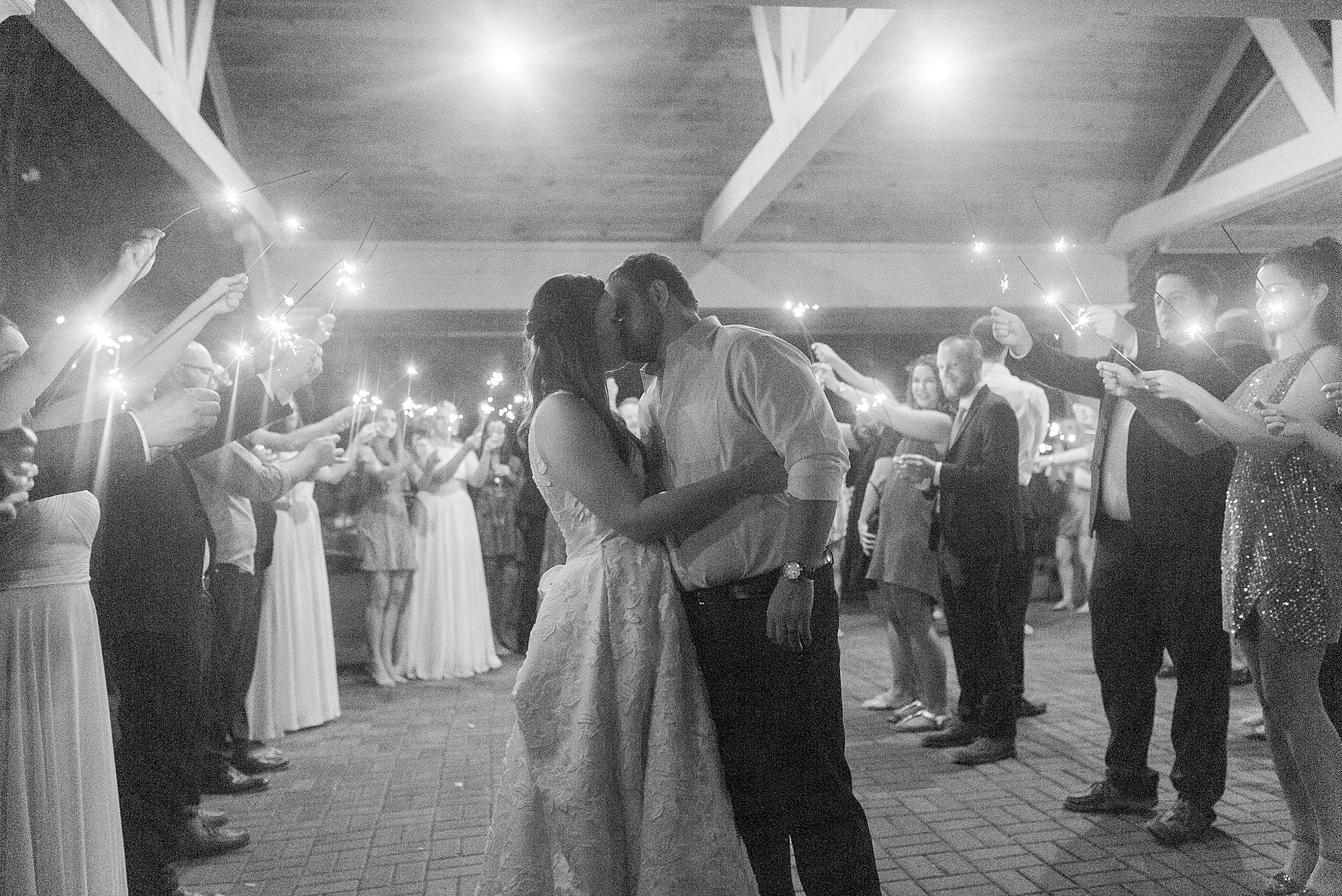 newlyweds leave Blowing Rock NC wedding reception during sparkler exit