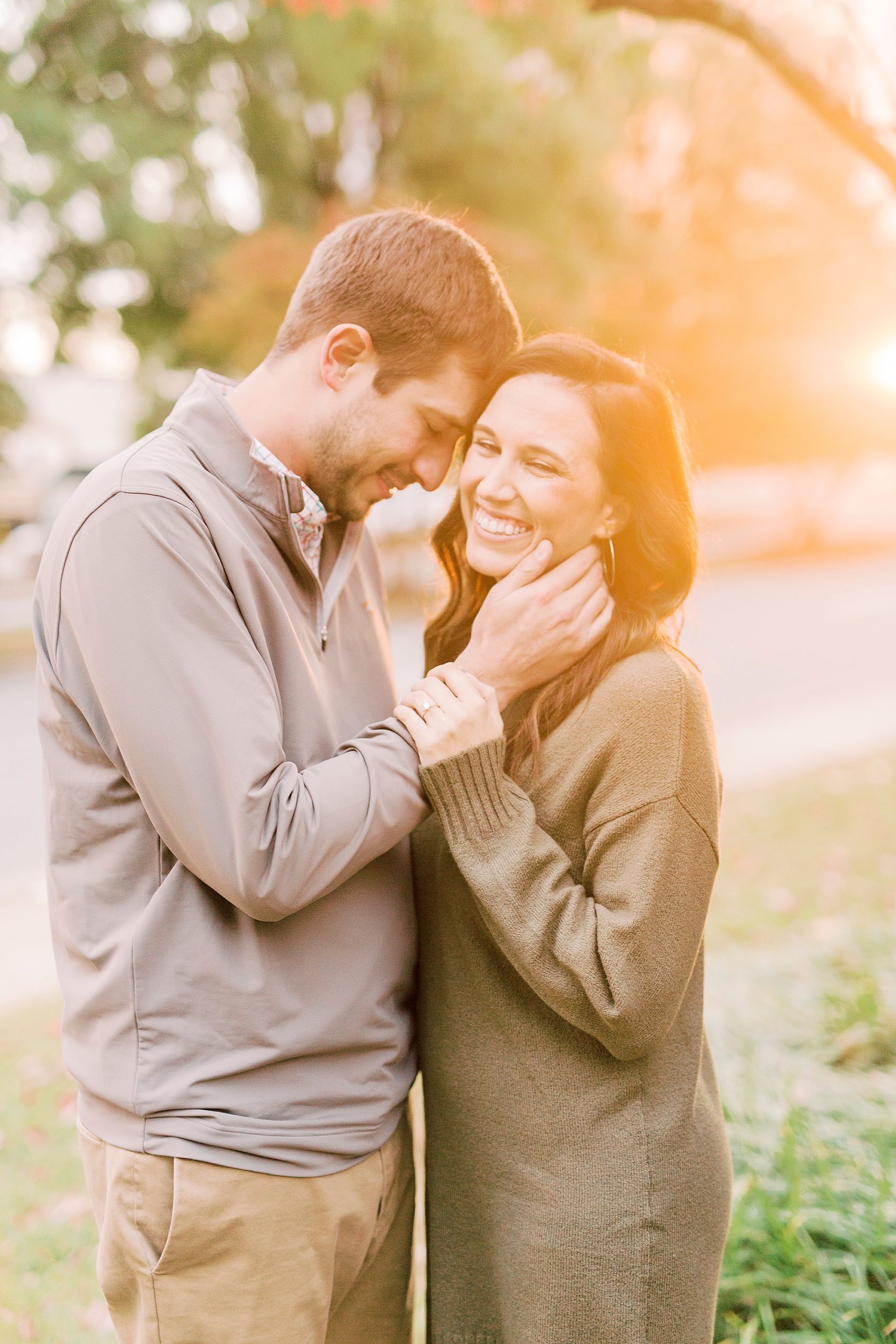 couple laughs at sunset during Marshall Park engagement session