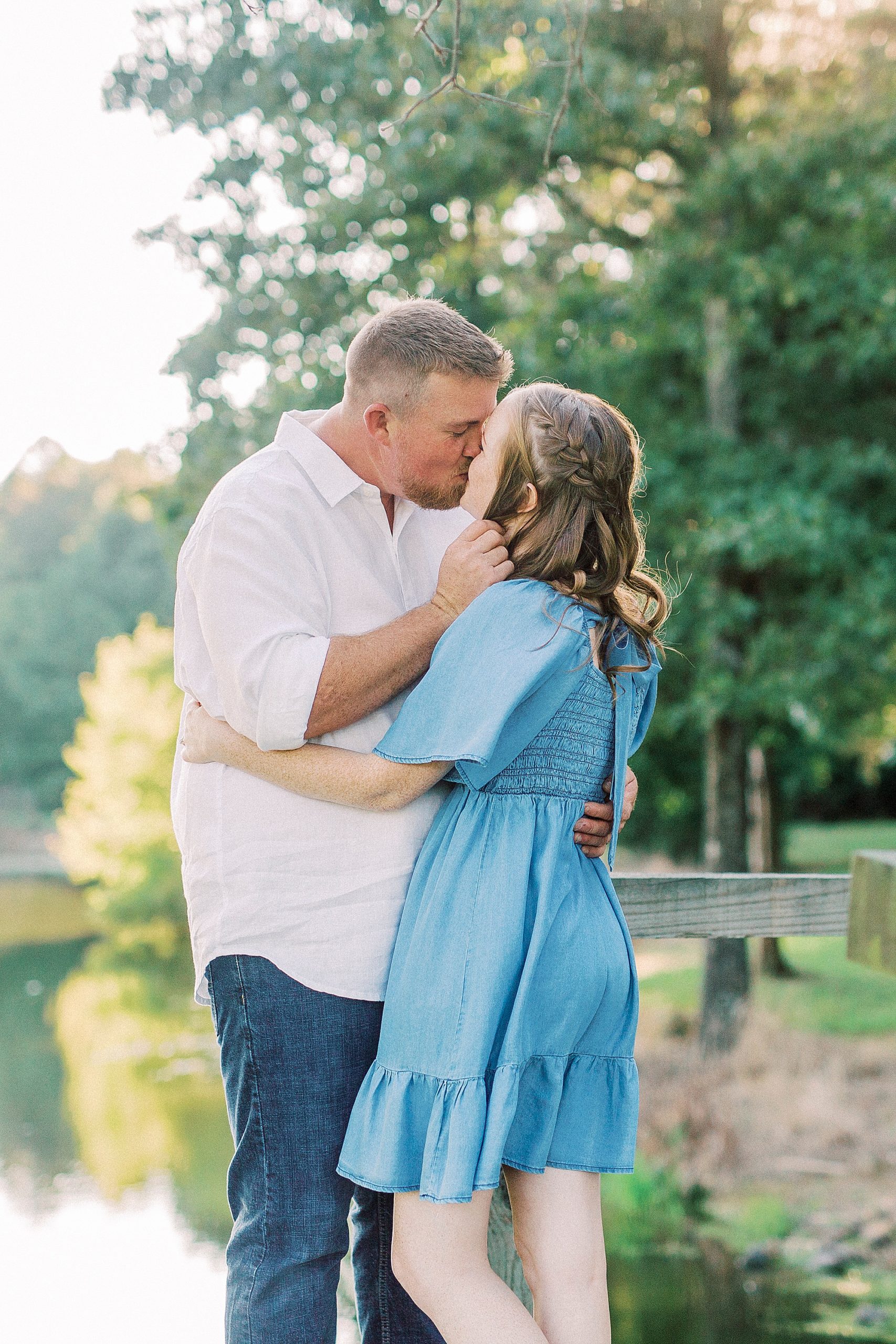 bride and groom kiss during Sunset Farm engagement session
