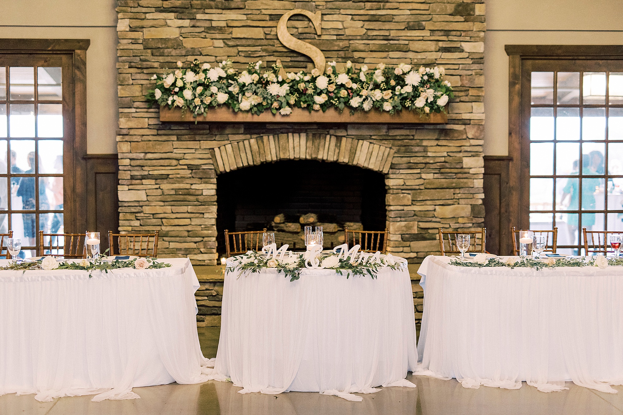 sweetheart table by brick fireplace at Addison Farm
