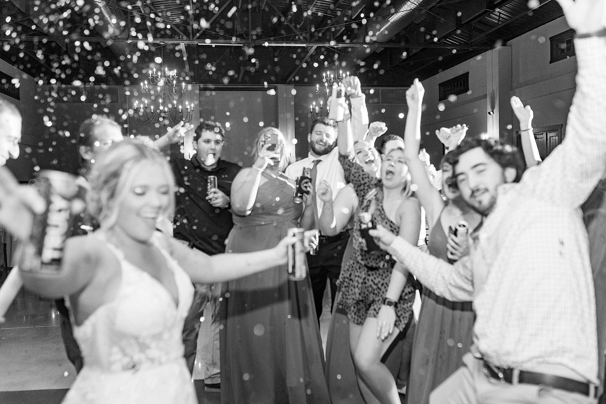 wedding guests pop confetti during Greensboro NC wedding reception