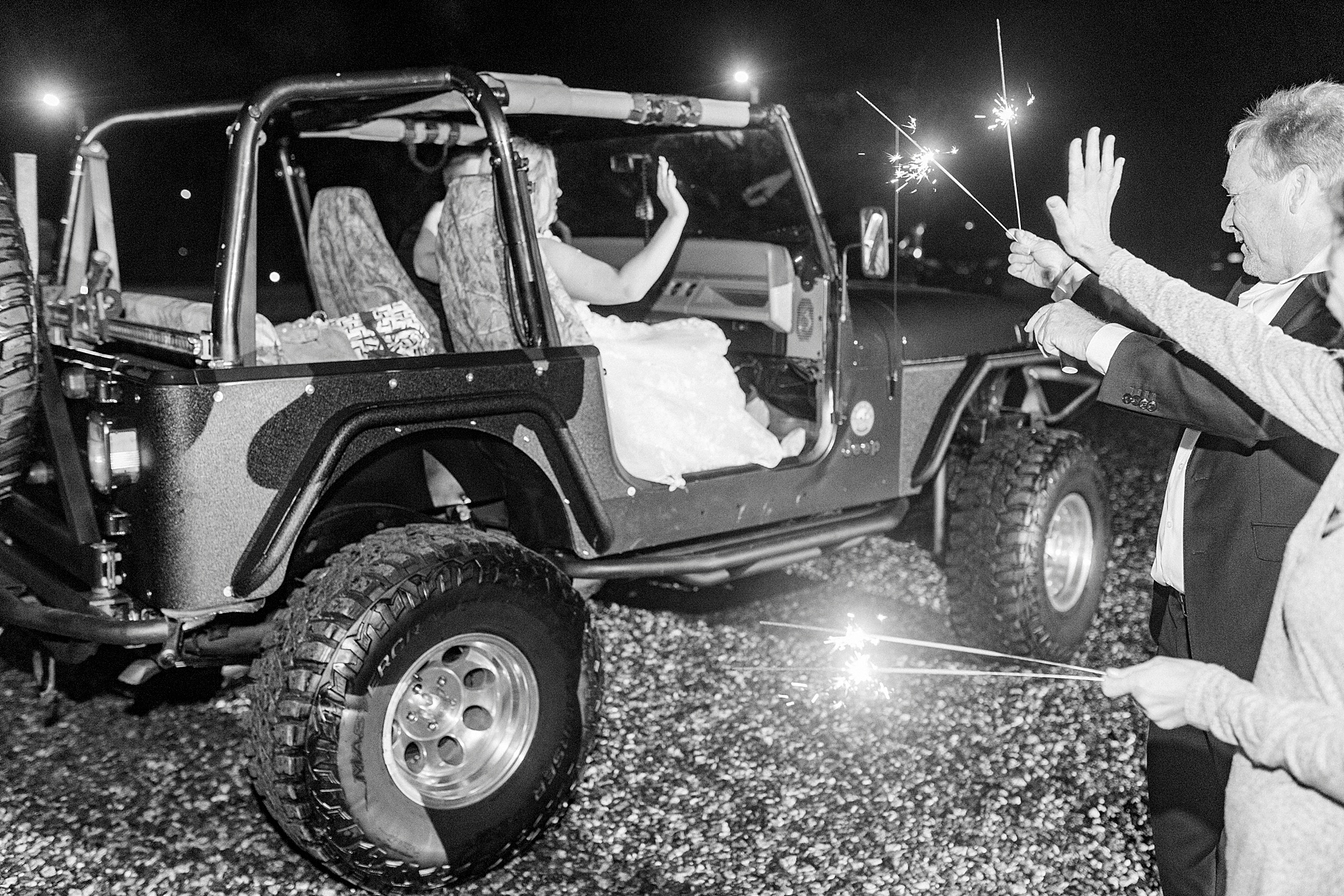 bride and groom leave Addison Farm Wedding in Jeep