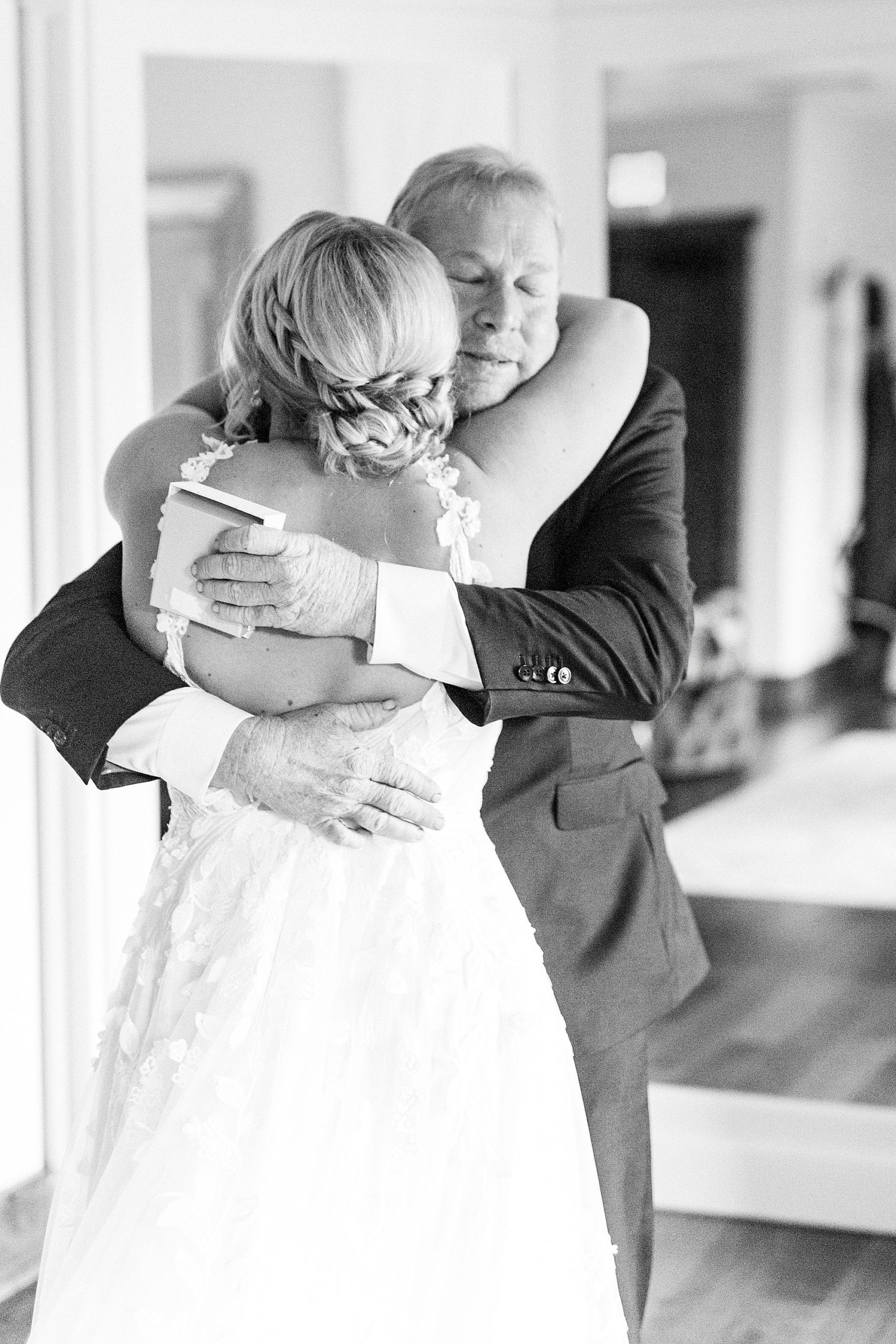 dad hugs daughter after first look on wedding day