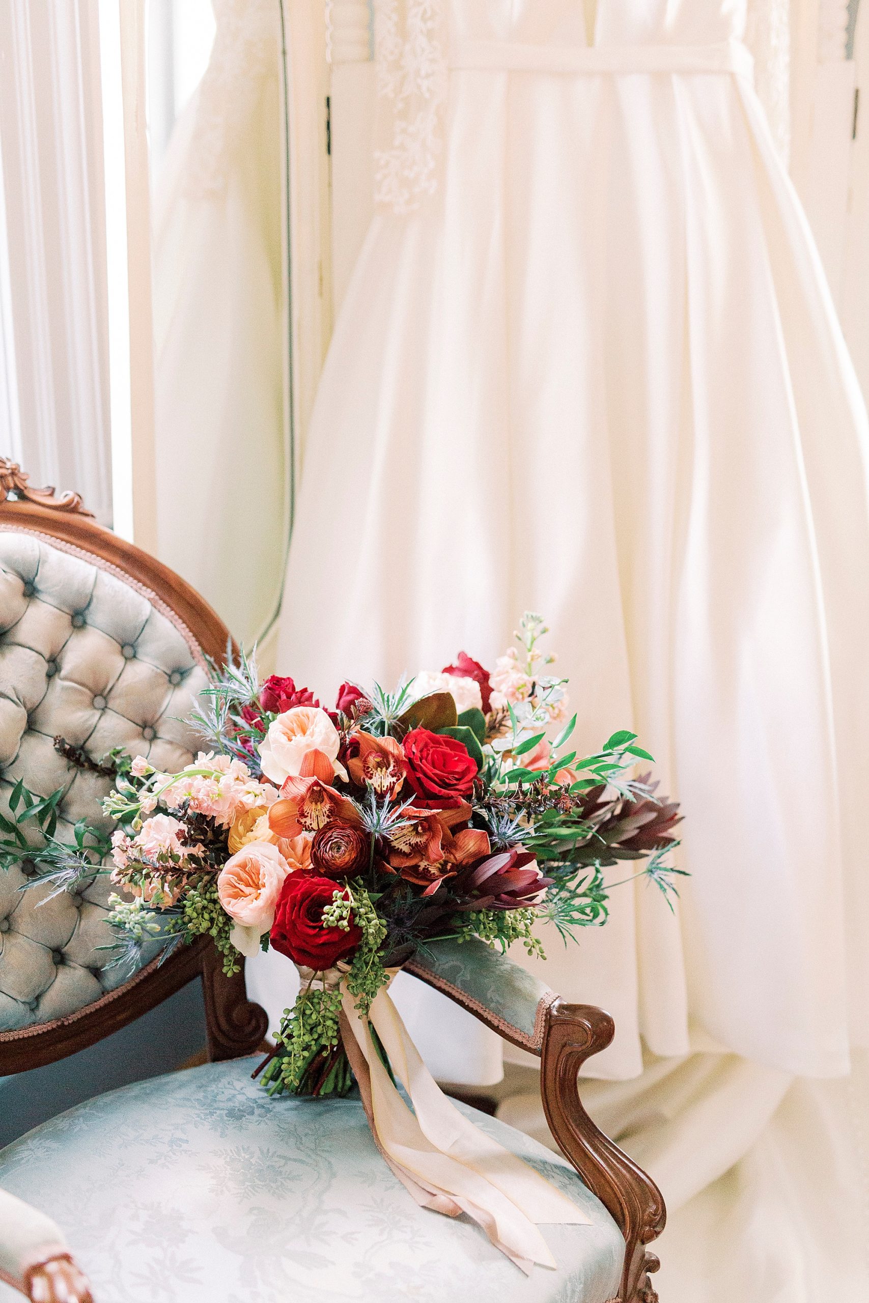 bride's bouquet rests in blue chair at Vesuvius Vineyards
