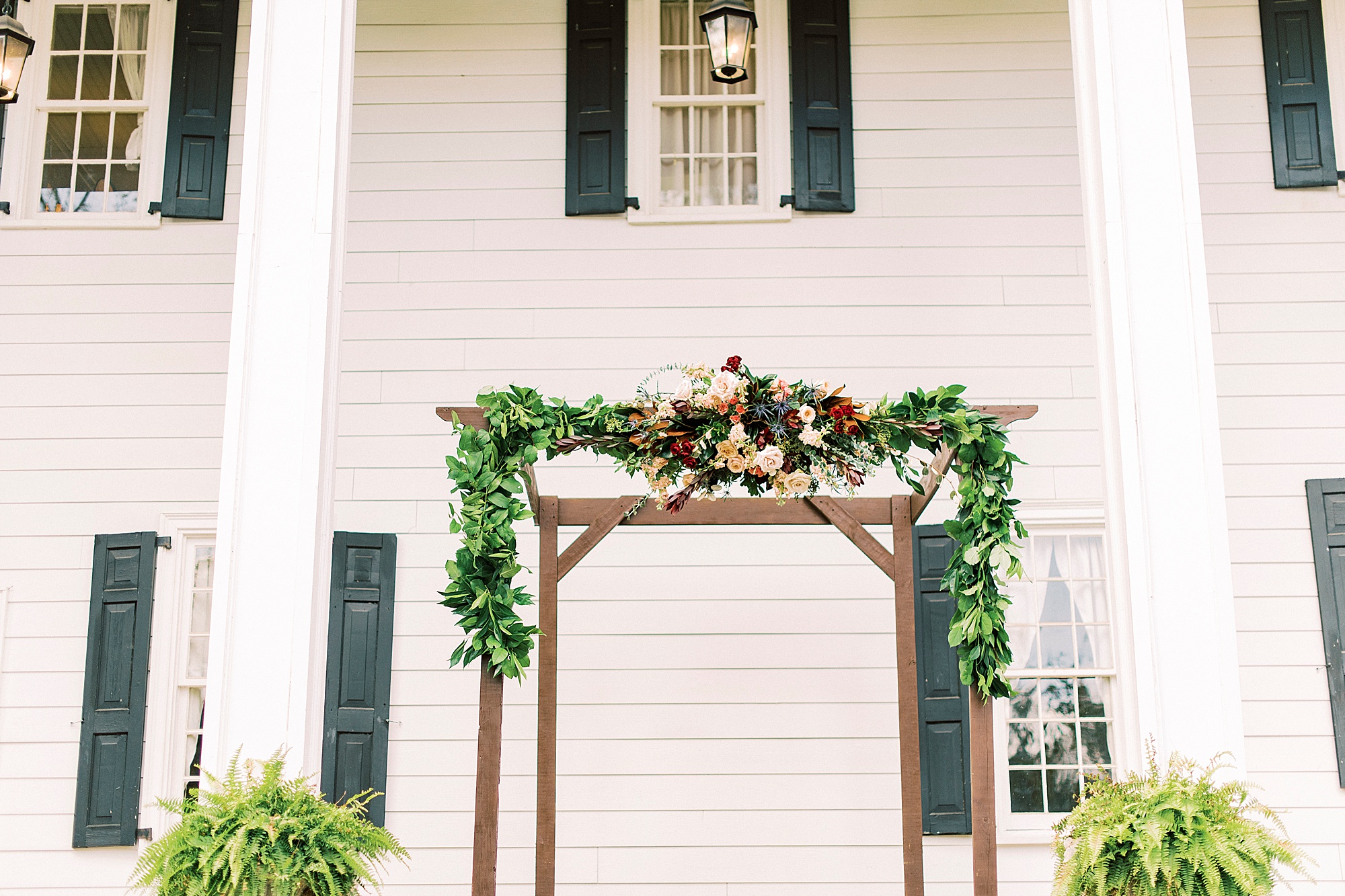 wooden arbor with floral accents for Lincoln County wedding ceremony