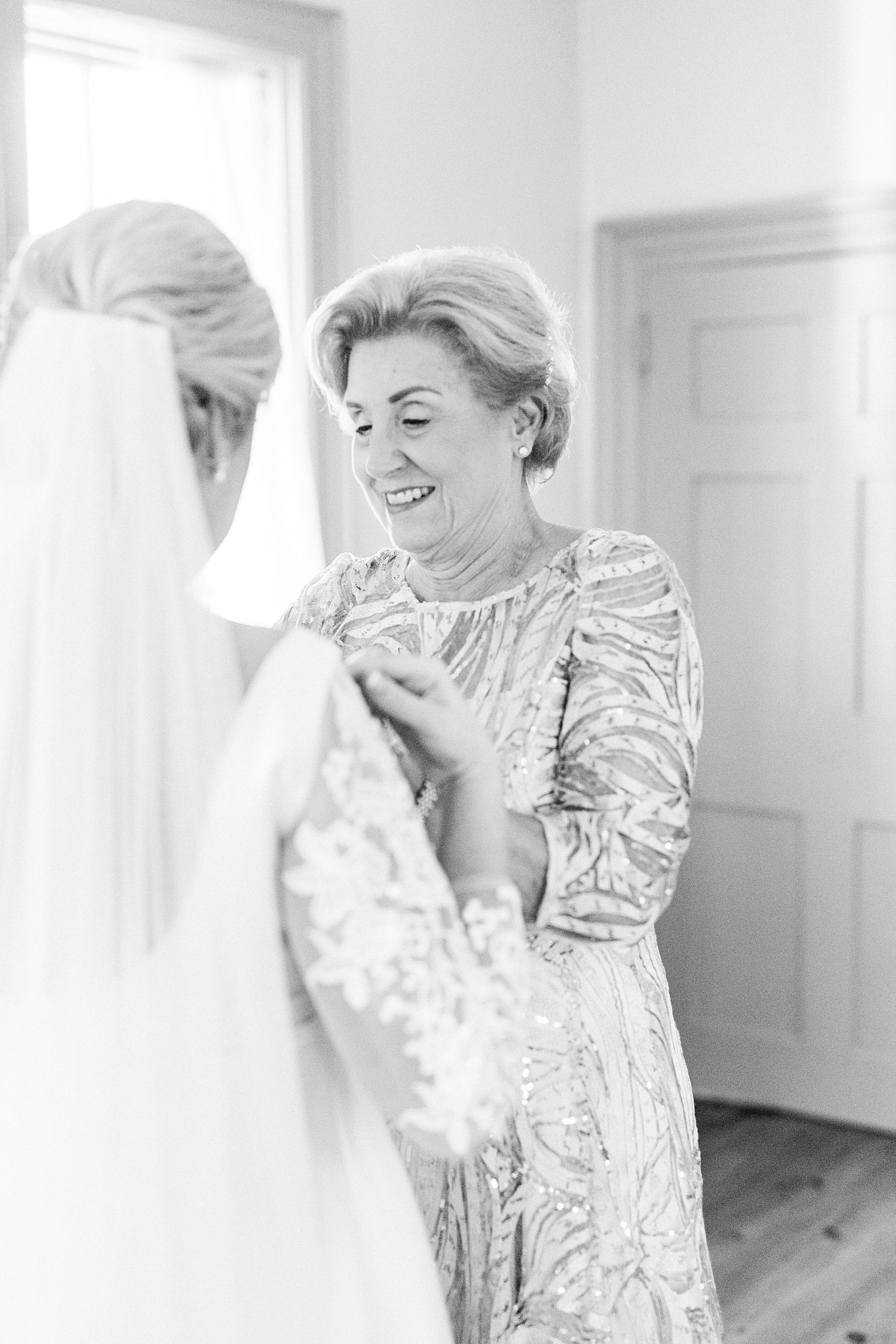 mother helps daughter with gown during Vesuvius Vineyards wedding