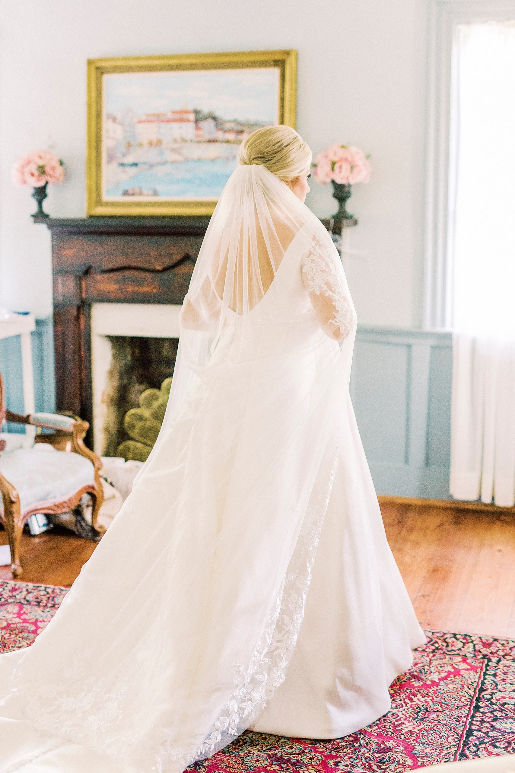 bride stands with veil down back on Vesuvius Vineyards wedding day