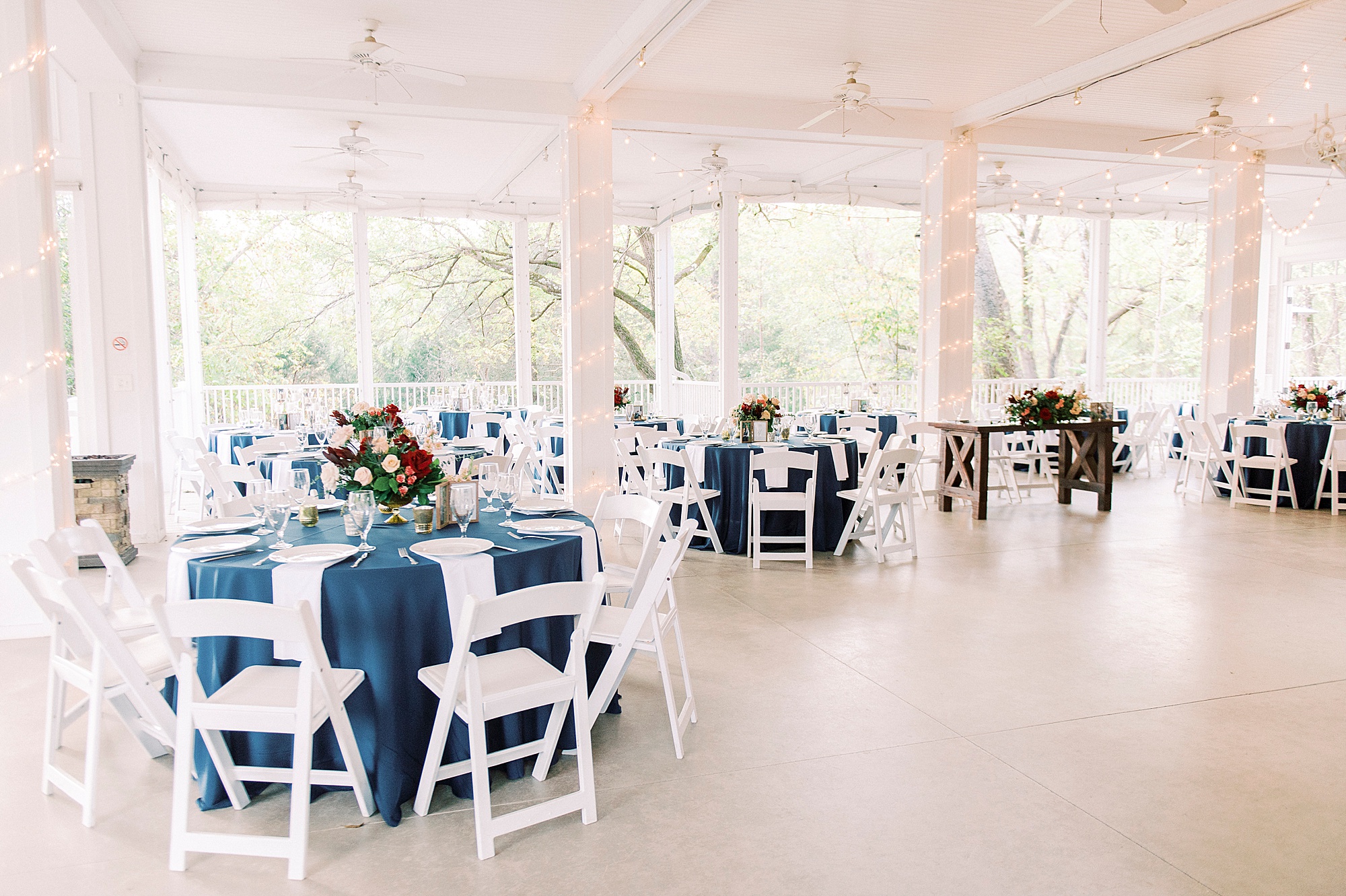 NC wedding reception seating with navy tablecloths