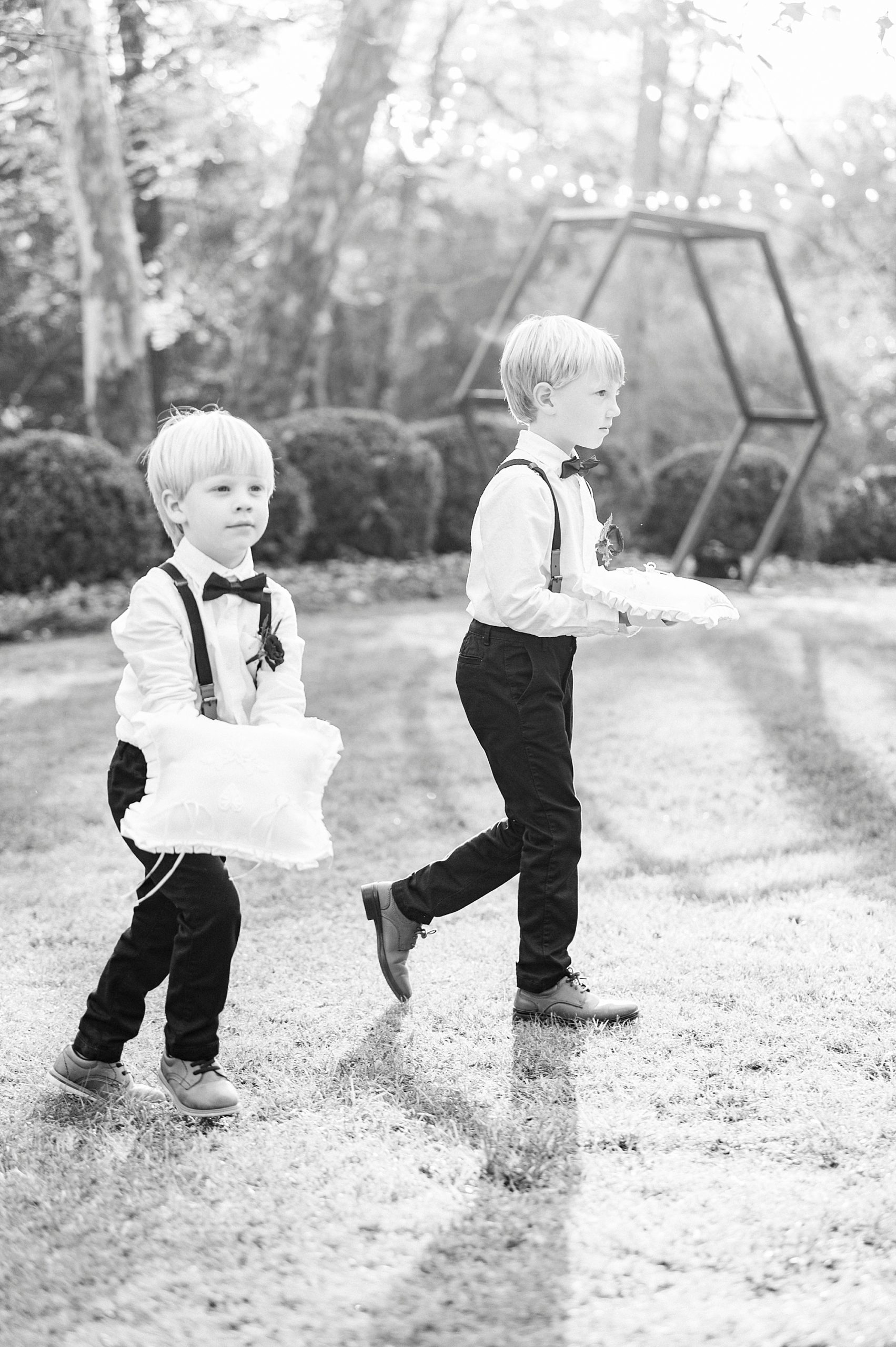 ring bearers walk down aisle for NC wedding ceremony