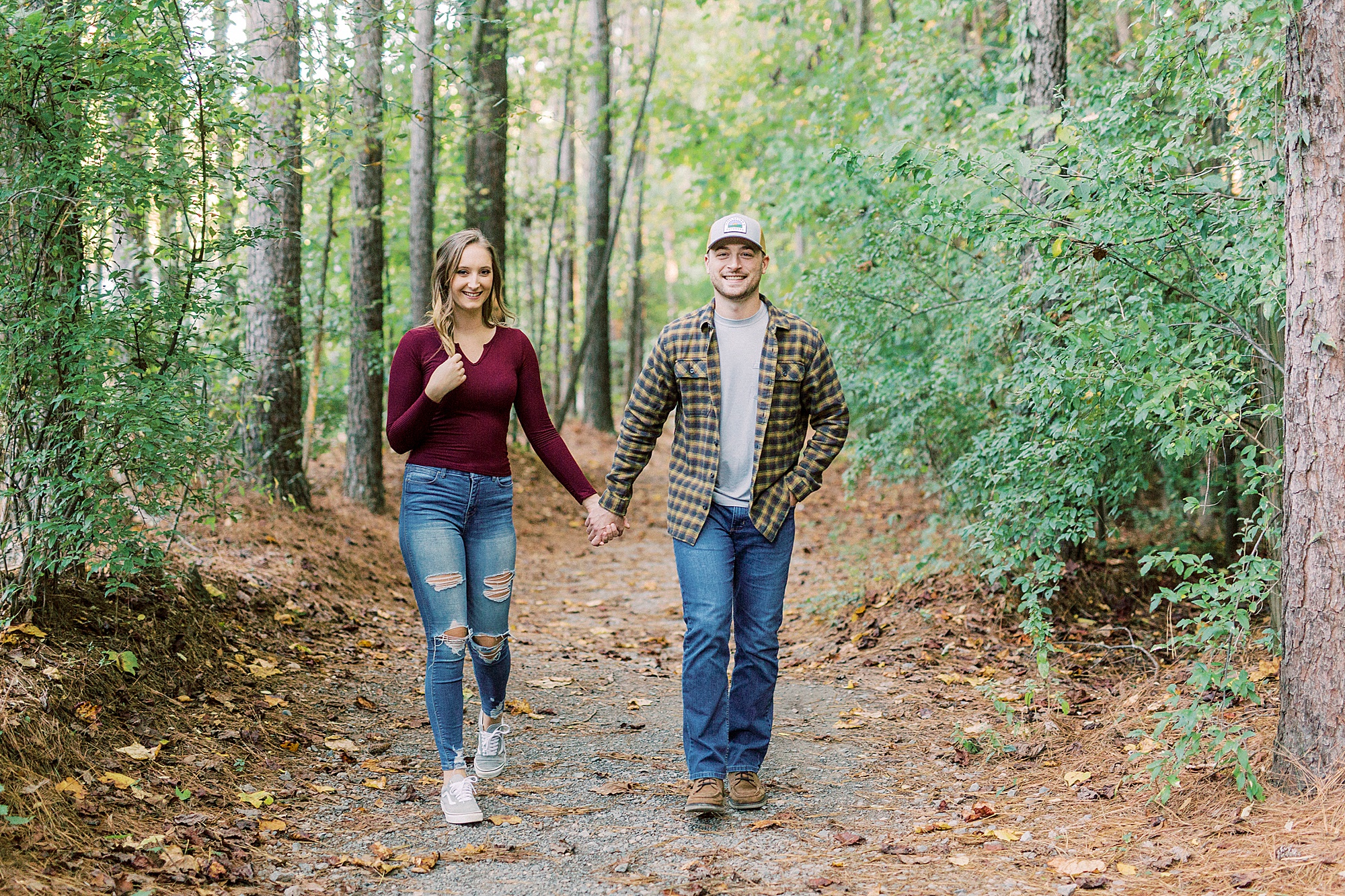 bride and groom walk through woods in Charlotte NC