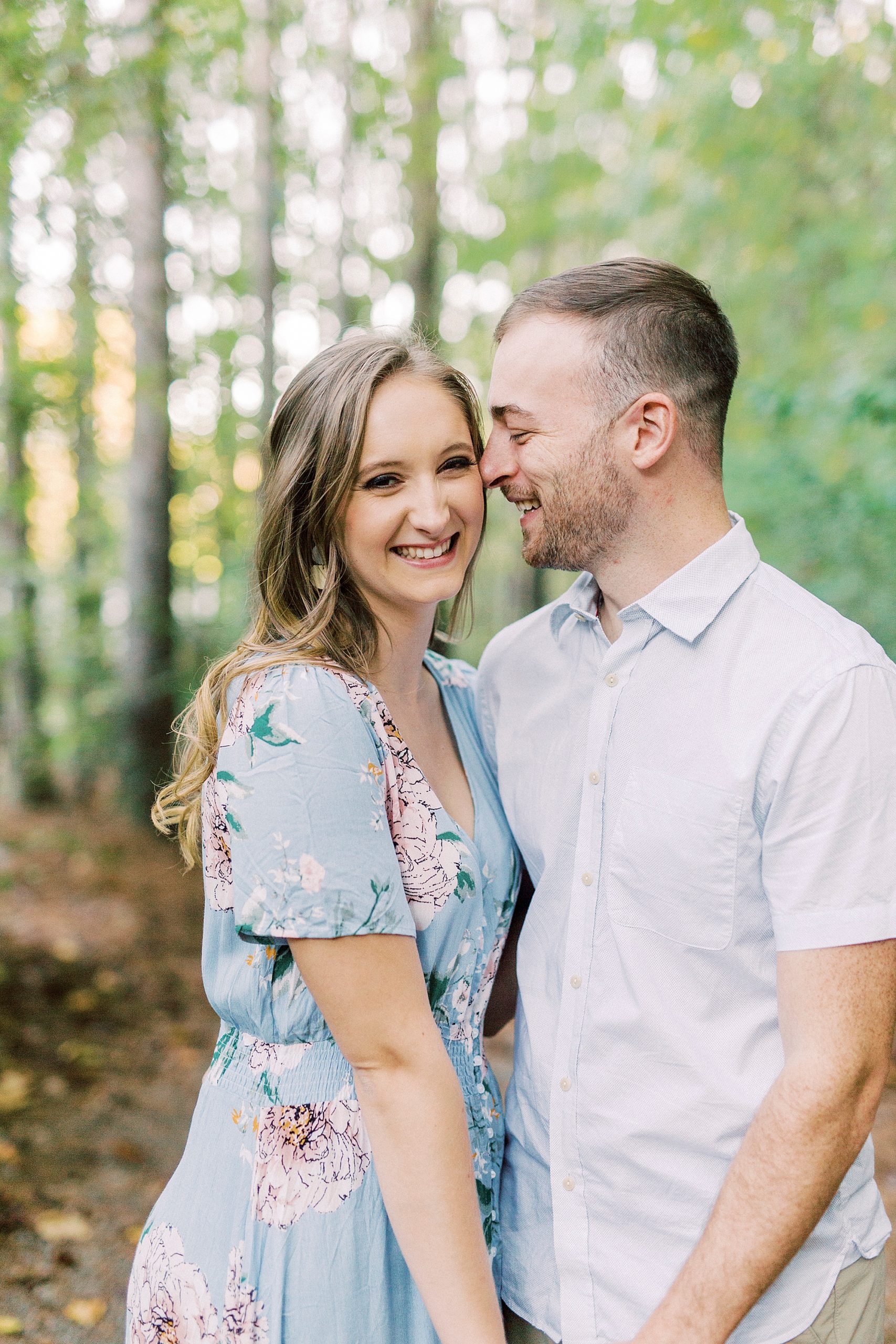 groom nuzzles bride's cheek during NC engagement session