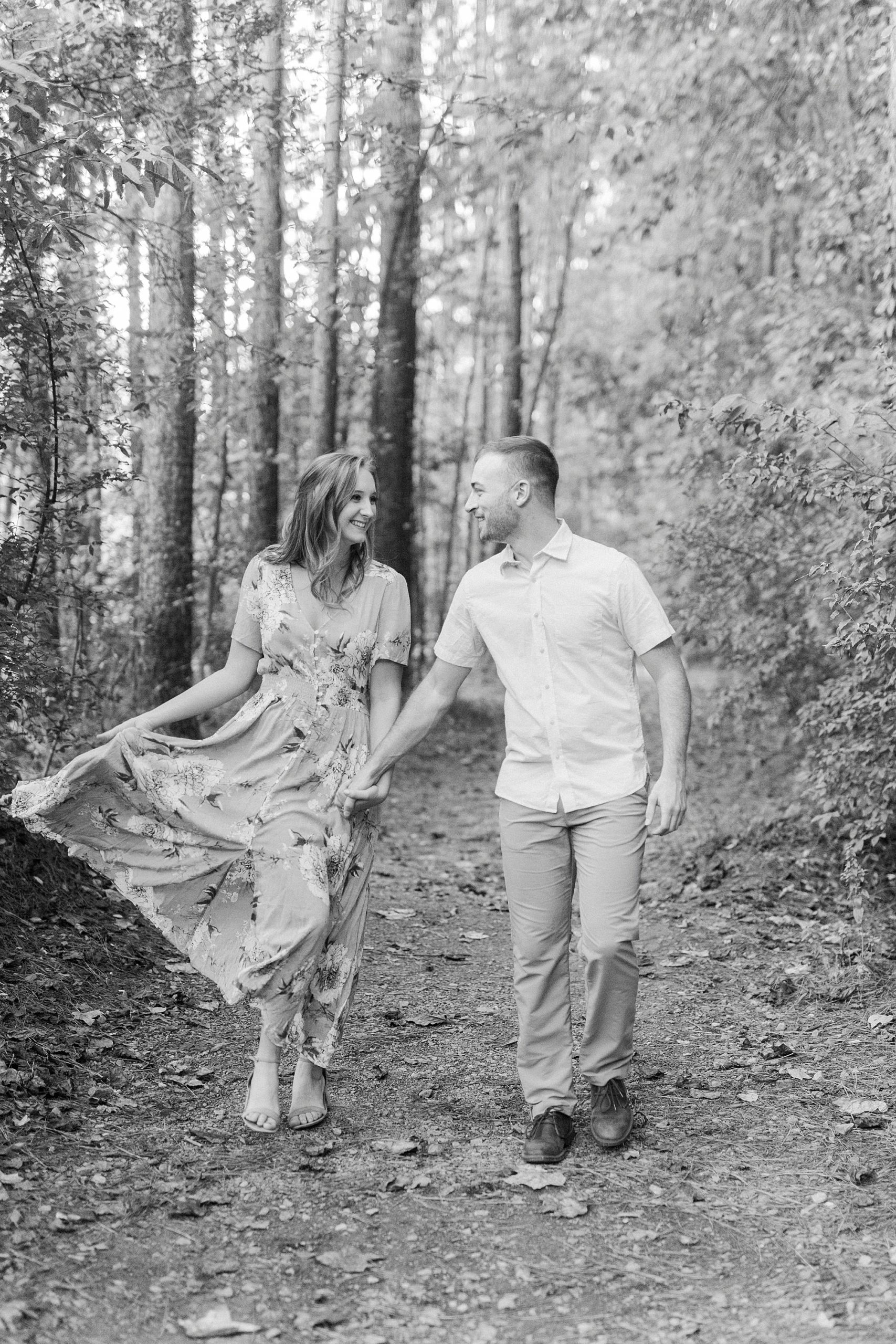 couple walks through woods at the Whitewater Center