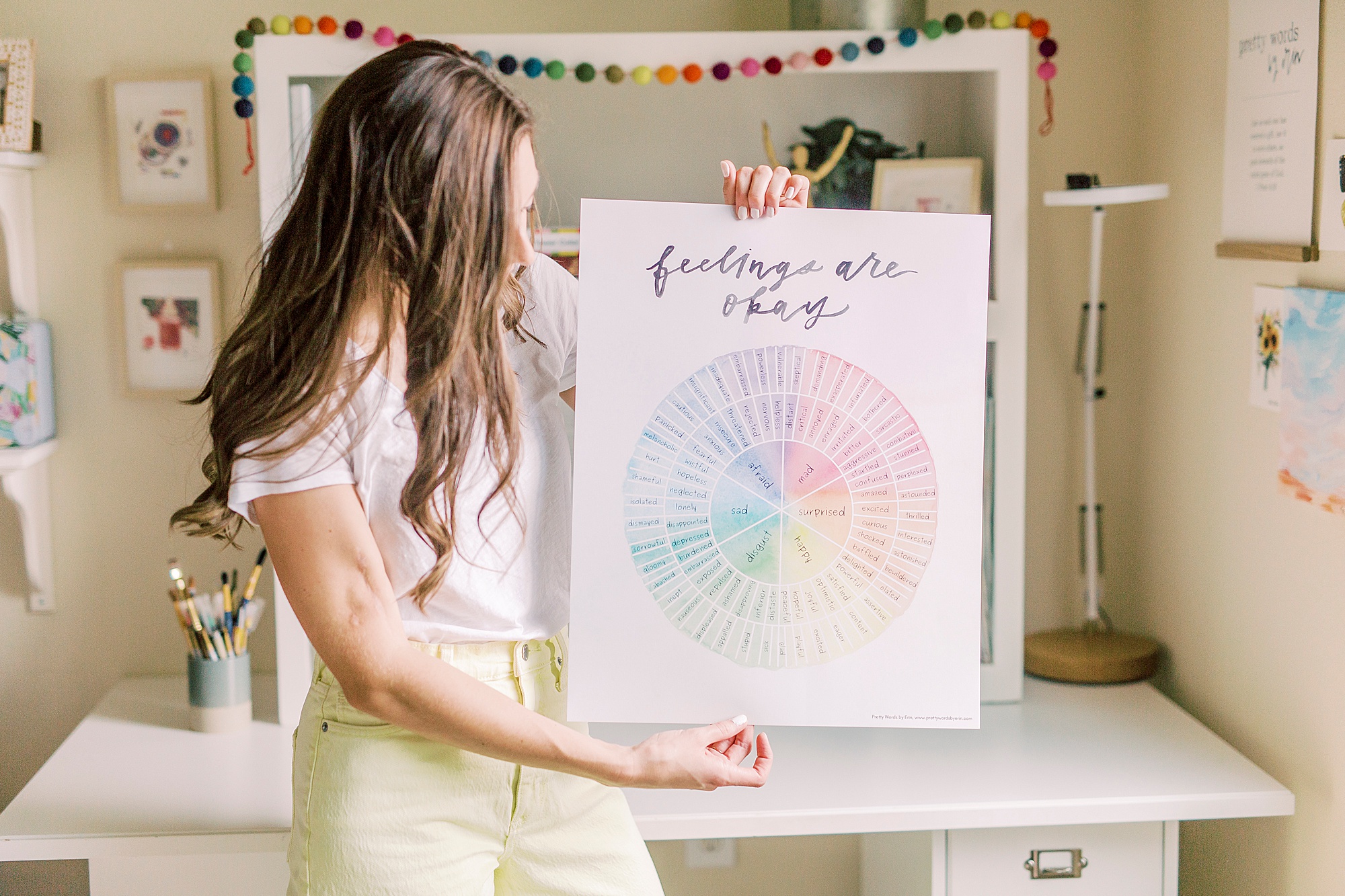 watercolor artist holds color wheel