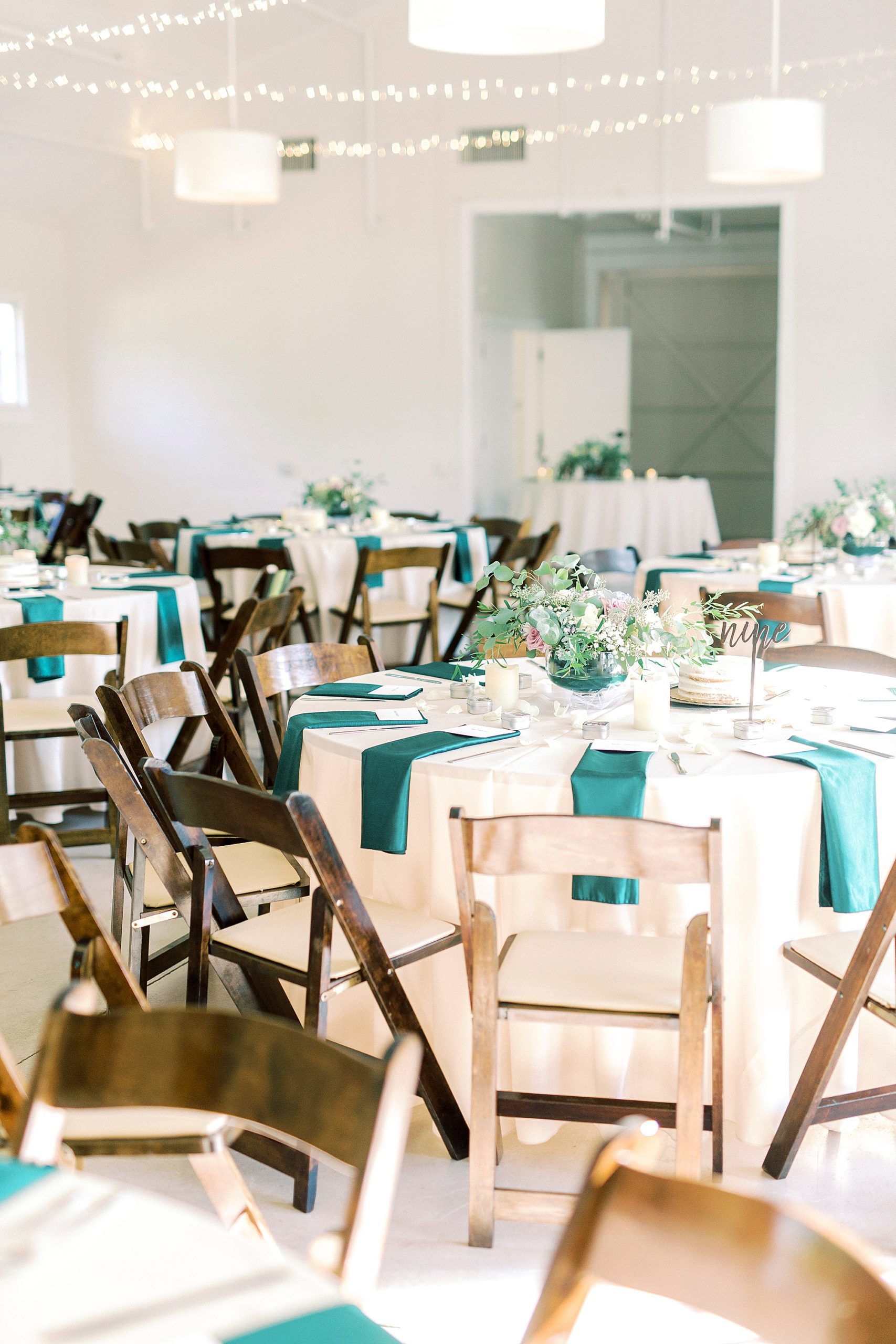 wedding reception at The Dairy Barn with emerald green details