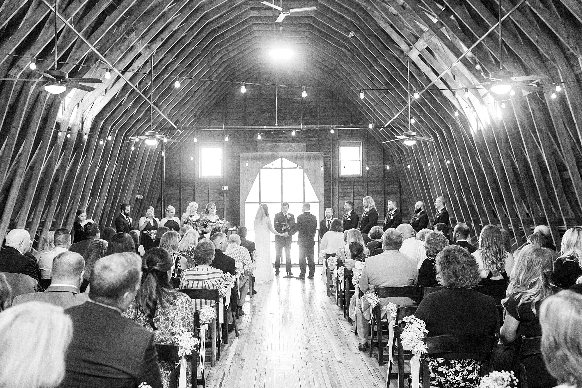 wedding ceremony in the barn at The Dairy Barn
